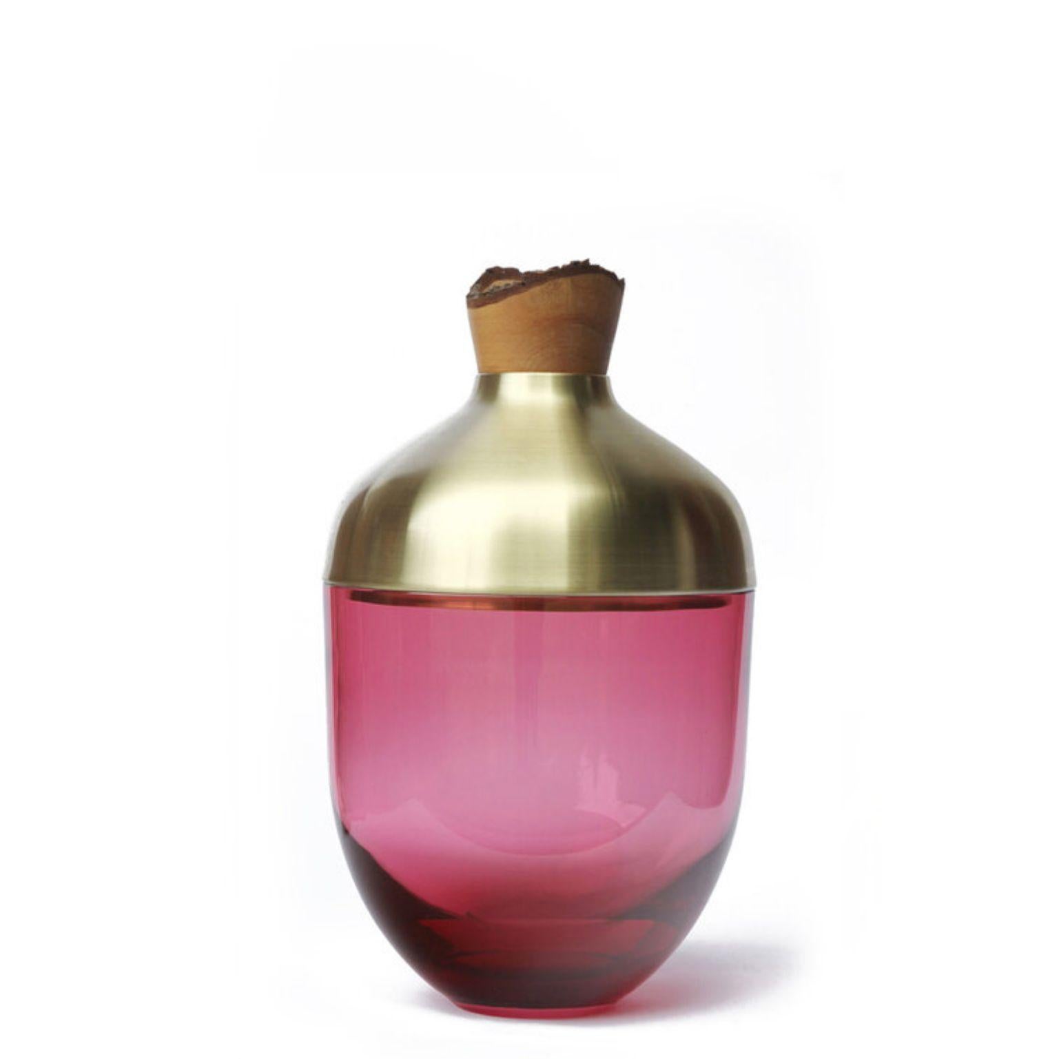 Sculpted blown glass and brass vase - Pia Wüstenberg
Dimensions: Height 55 x diameter 30cm
Both rough and refined, this assortment plays with the multiple metamorphosis glass grants as a material. The glass is first hand blown, and then cold