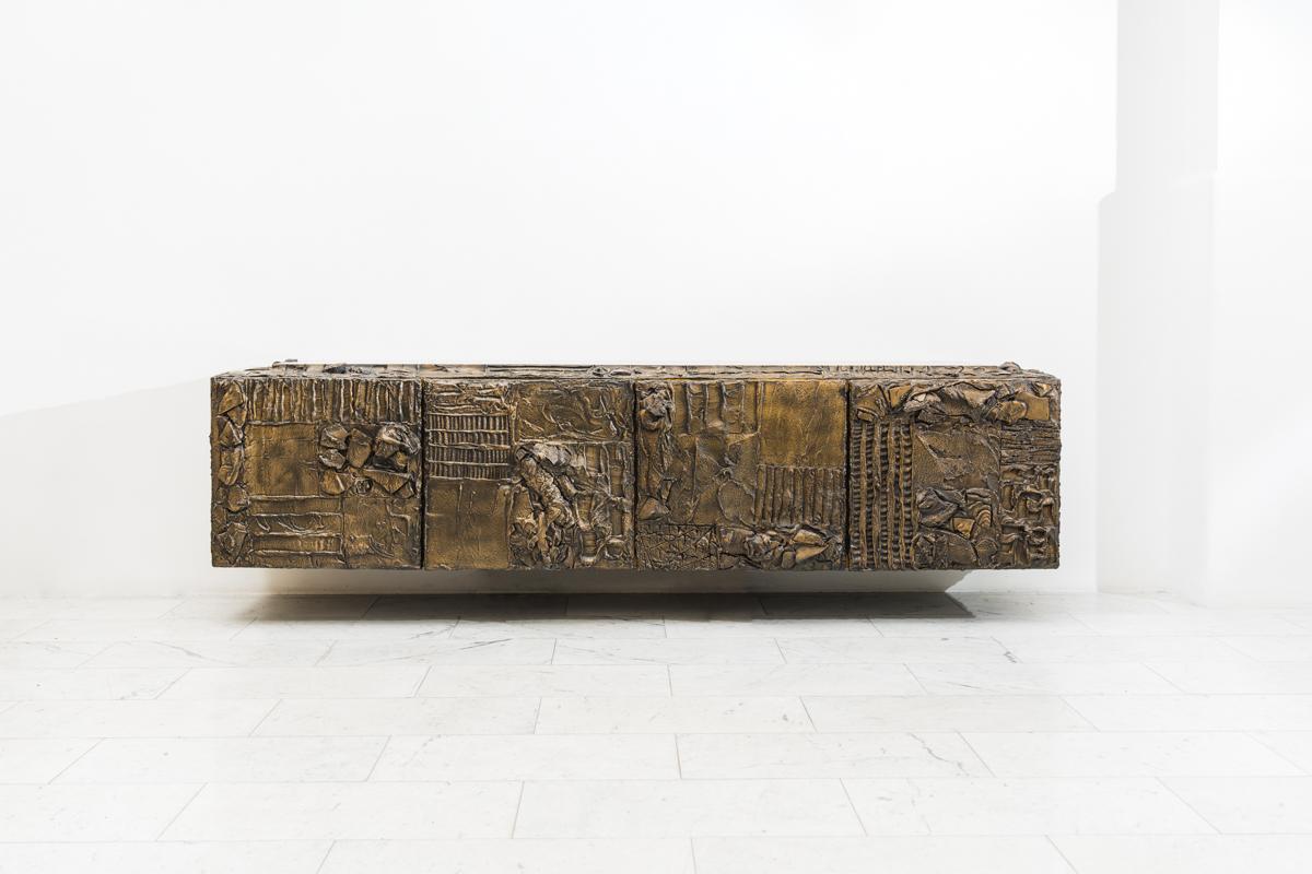 This large and impressive four-door Sculpted Bronze Console by Paul Evans from 1970 is one of the finest examples of this genre, commissioned directly from the Evans Studio. It has been in private hands for nearly 50 years. The exterior is boldly