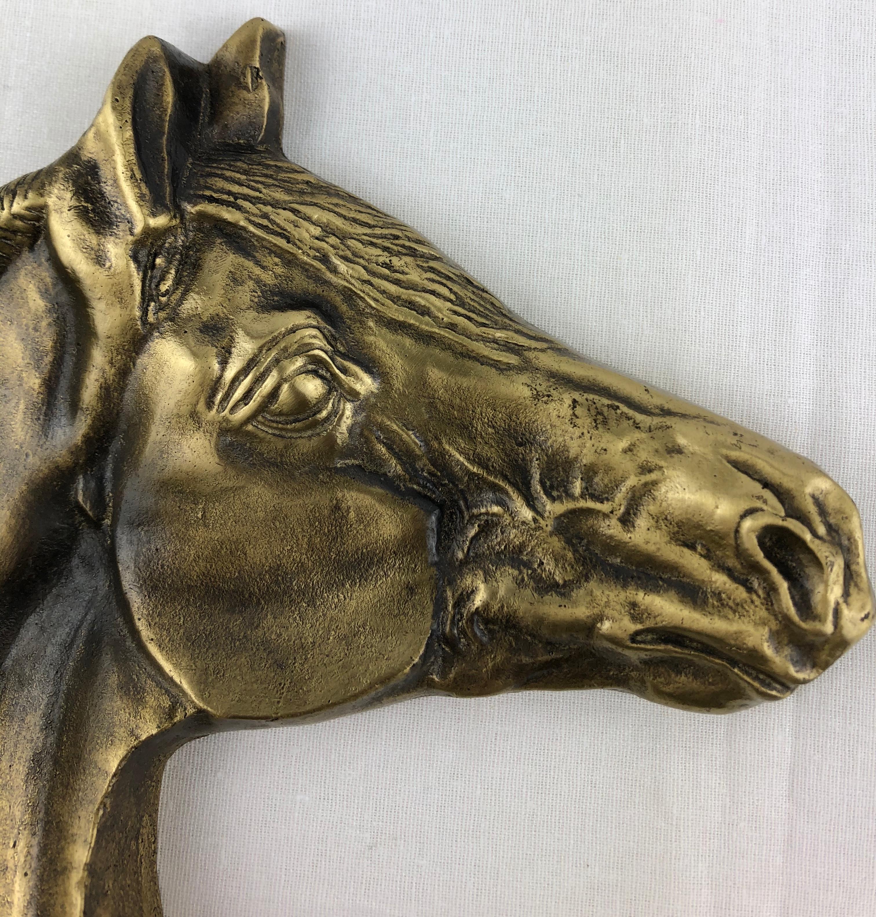 Excellent quality sculpted bronze featuring a horse's head which is a perfect key holder or vide-poche.

This wonderfully heavy bronze piece is beautifully handcrafted and displays very well on a desk, coffee table or console near an entry.

Stamped