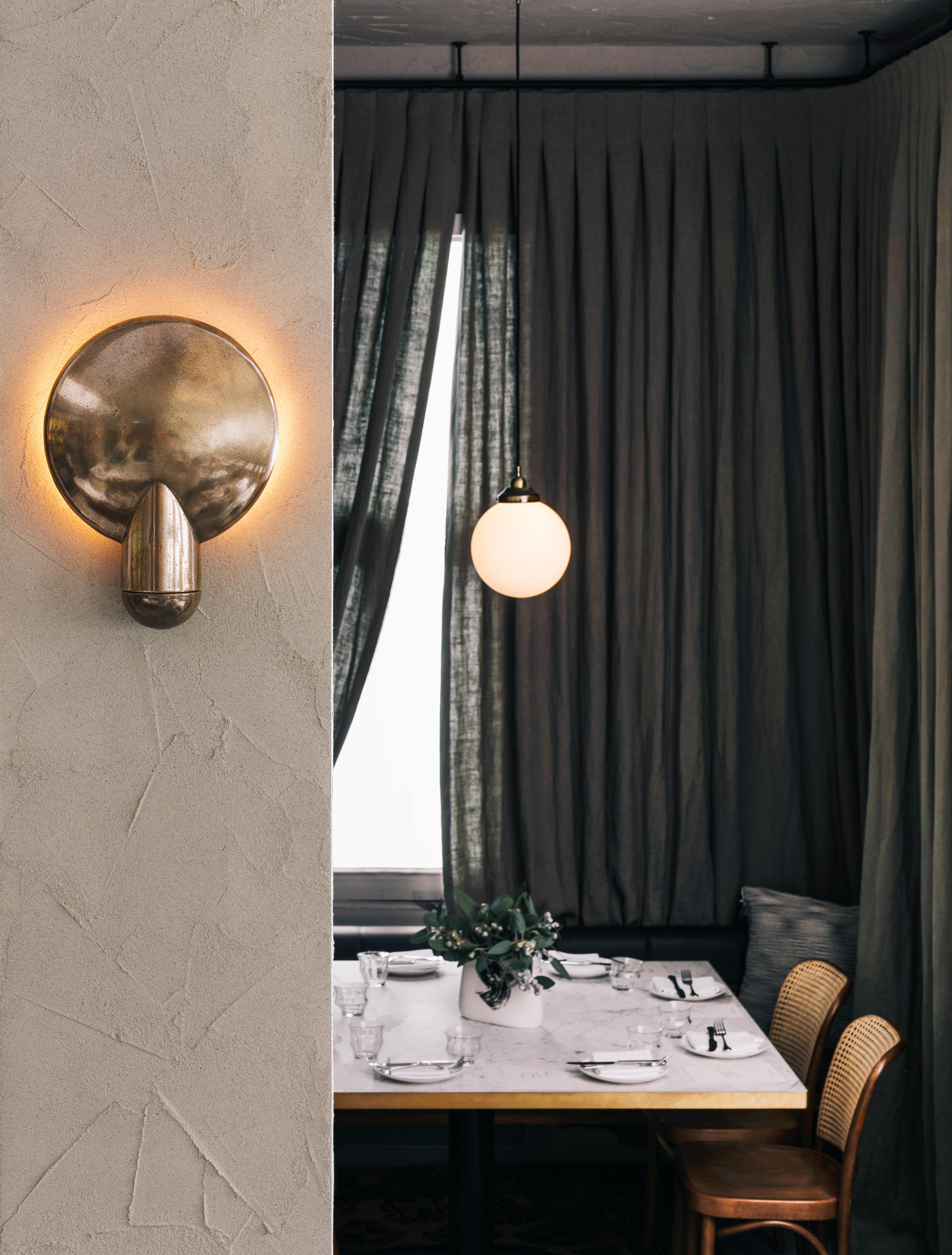 Sculpted bronze sconce light by Henry Wilson
This sculptural item is handmade in Sydney, Australia.
Sandwiched between the two bronze components, the light source is projected onto the concave backing. The light follows the gentle bowl of the dish