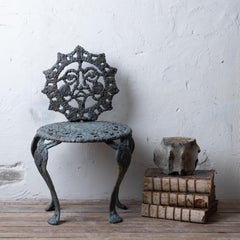 Sculpted Bronze Sun Face Chair
