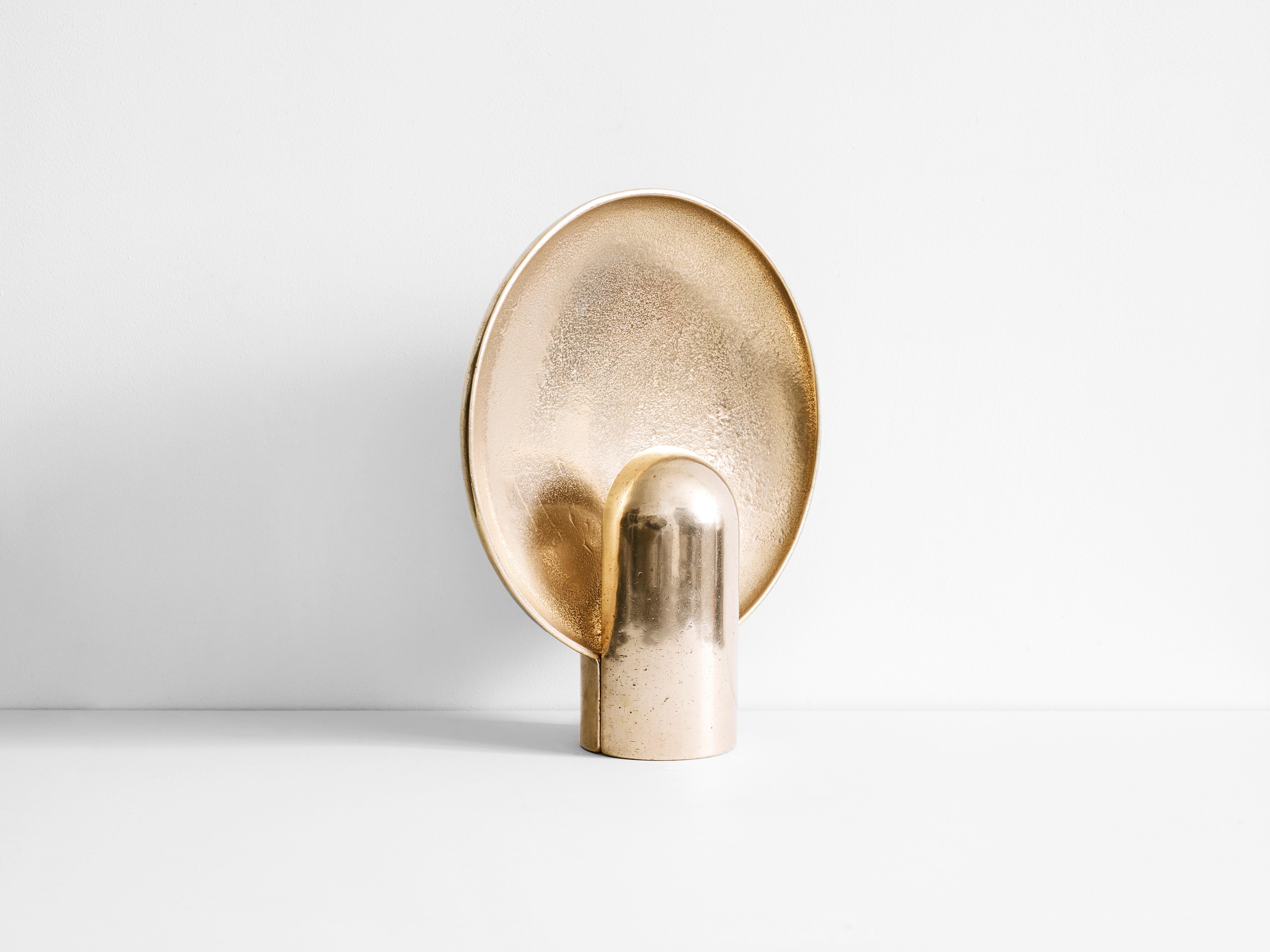 This sculptural item is handmade in Sydney Australia.
Also available in different stones.

The surface sconce is a ambient, sculptural light cast in two halves from solid gunmetal.

Each casting is manufactured in small batches meaning slight