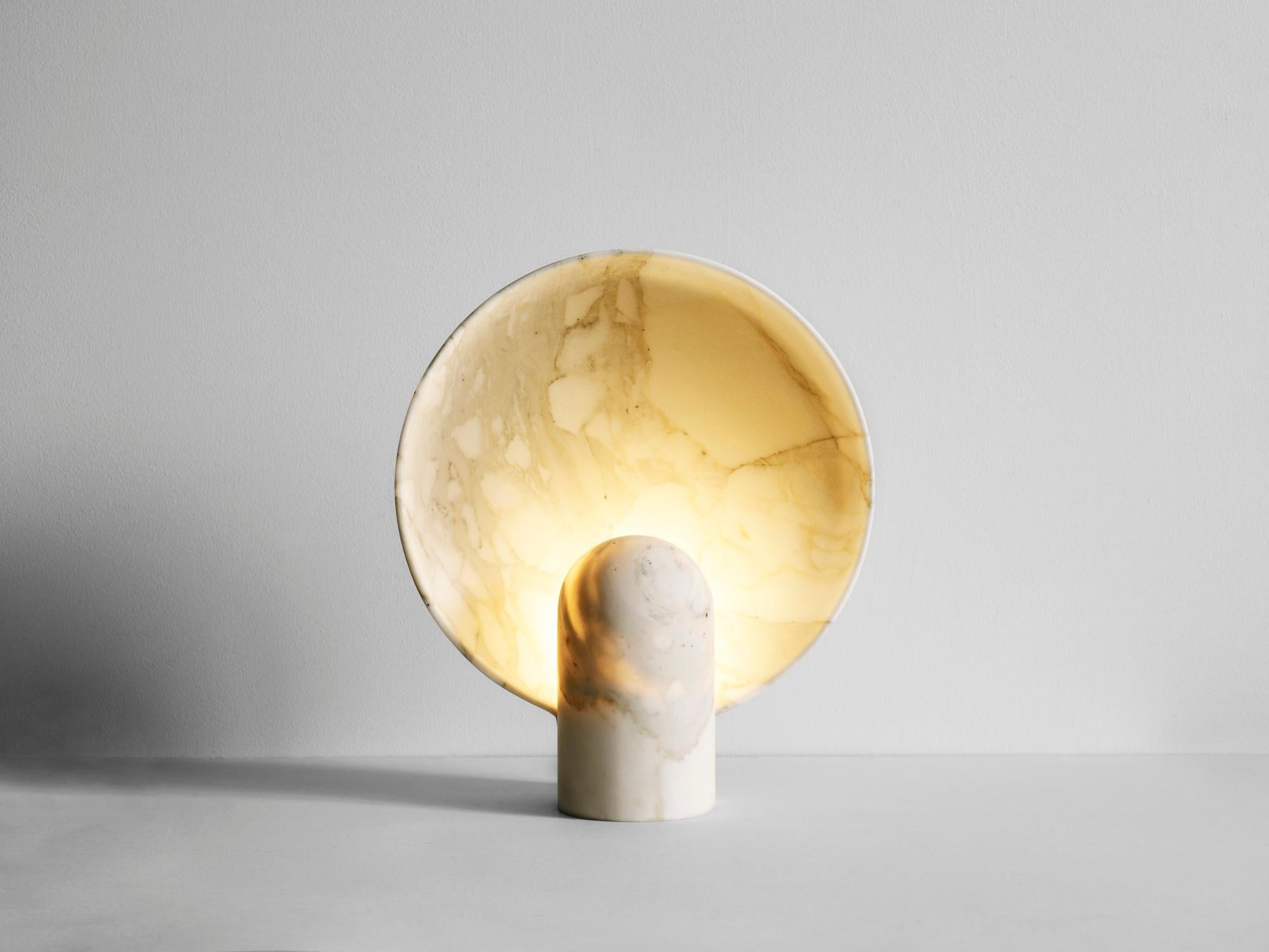 This sculptural item is handmade in Sydney Australia.

The surface sconce in Calacatta marble is an ambient, sculptural light carved in two halves from solid stone.

Each light is manufactured in natural stone, meaning variations of the pattern