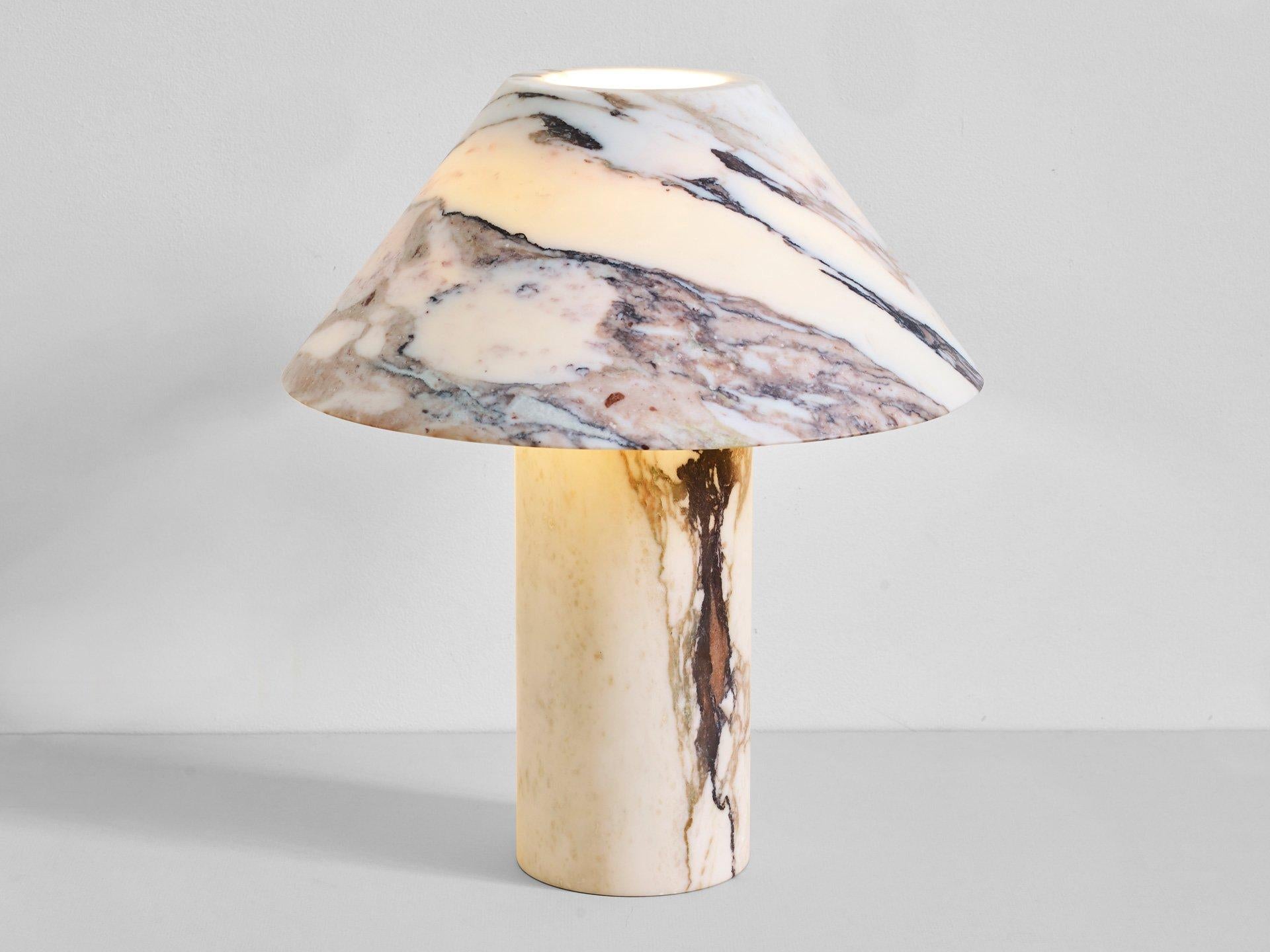 Sculpted Calacatta marble lamp by Henry Wilson

This sculptural item is handmade in Sydney Australia.

Pillar lamp is hewn from two pieces of solid Calacatta viola marble.
Dimensions: 40 x 12 x 35 cm (H x B x Ø)
Each light is manufactured in