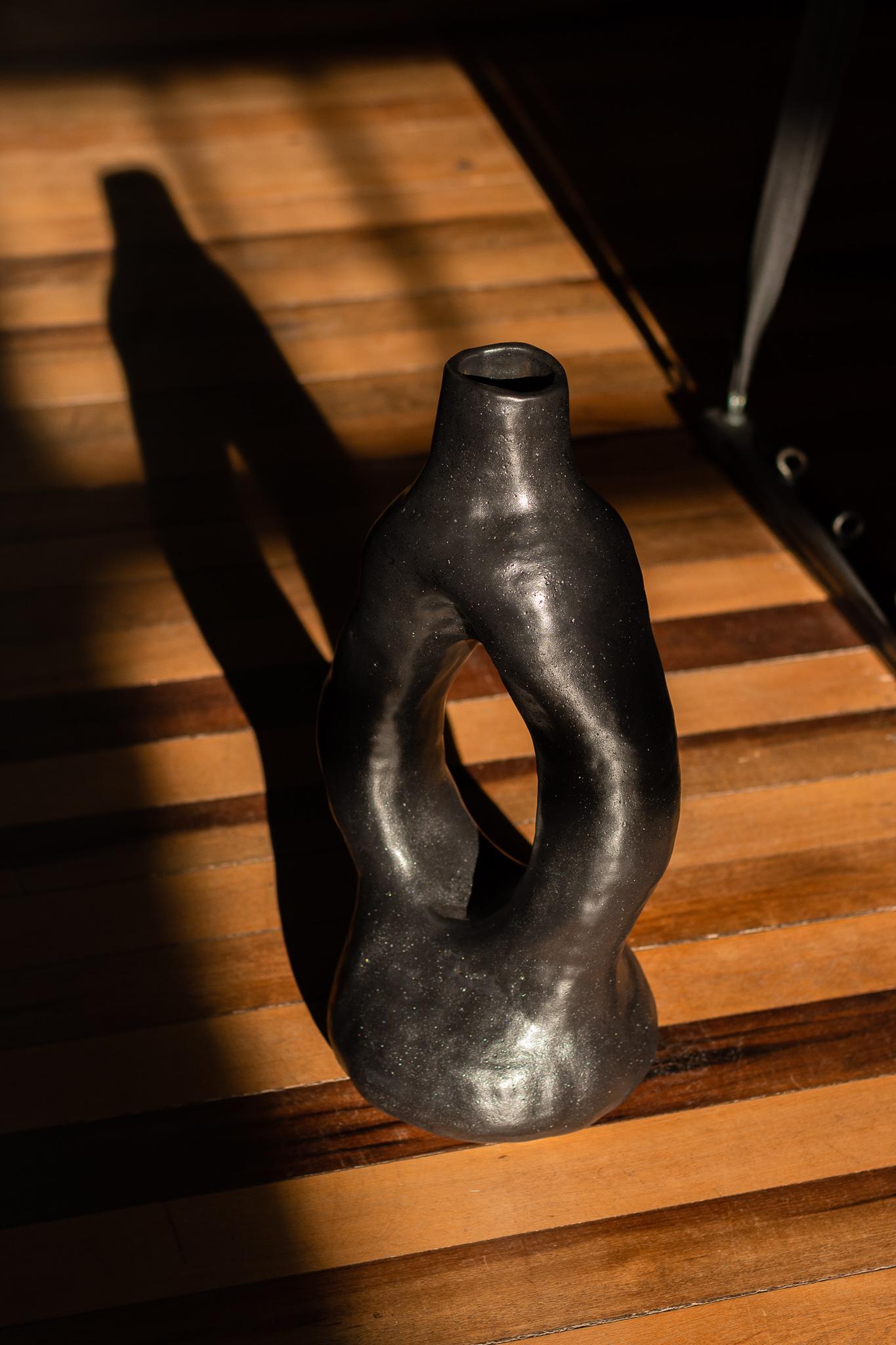 The vase from the Alba series, especially the N.2 vase, is a unique piece that embraces the artisanal process. Manufactured without the use of molds, each vase absorbs the distinct contours and textures of the artist's hand, resulting in a clean and