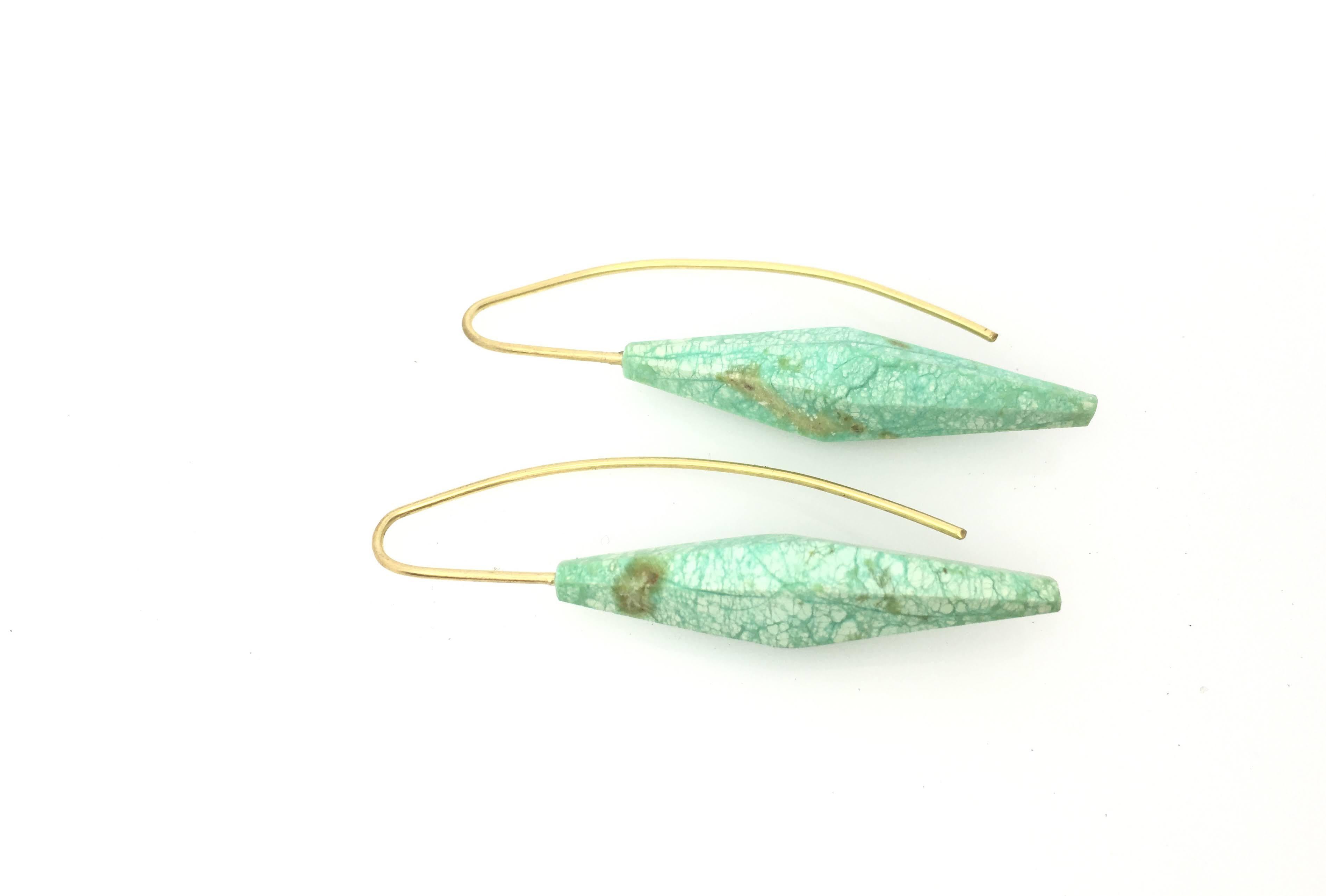 One-of-a-kind Chrysoprase tapered and faceted drops on 18k yellow gold wire earrings. 1.9 inches long .33 inches wide. This chic minimal design adds a perfect, playful pop of color for any skin tone or hair length.


About Claudia Endler
