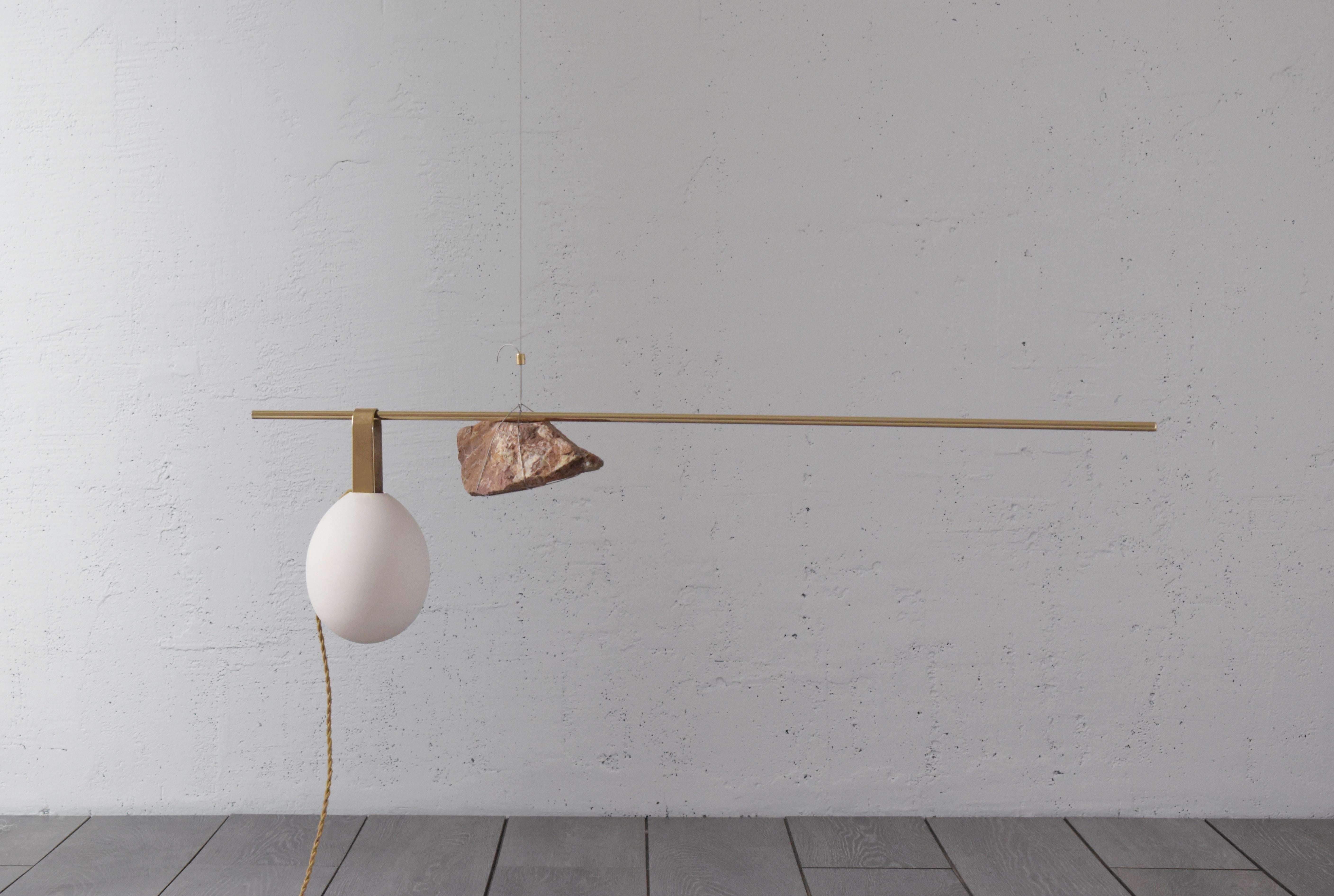 Sculpted lighting hatching eggs no 3 by Periclis Frementitis
Signed by Periclis Frementitis
Studio: HIGHDOTS
Dimensions: D 15 x W 110 x H 35 cm
Materials: Brass, raw stone, porcelain, G4 LED bulb.


Total drop length: customizable. please