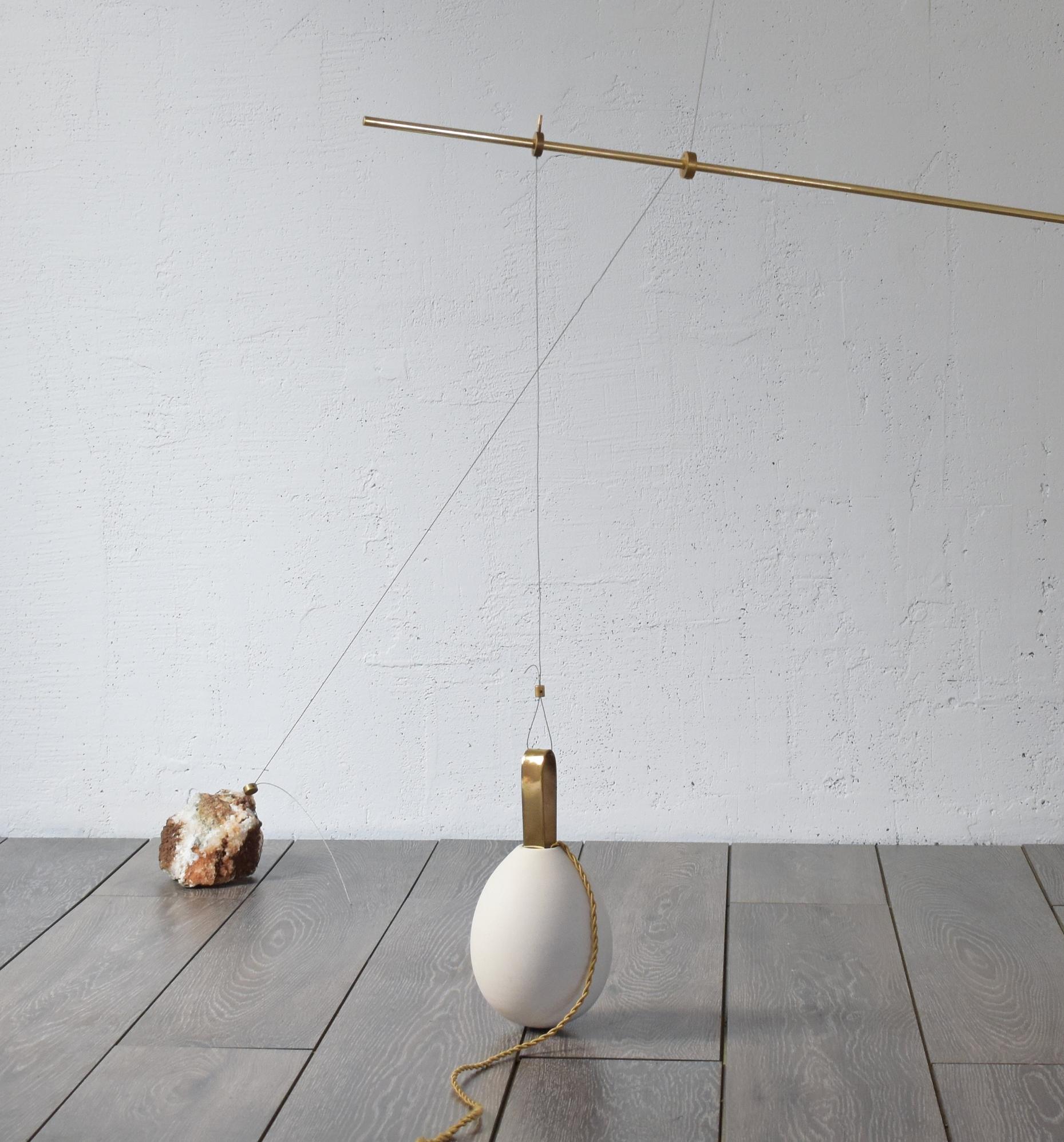 Sculpted lighting hatching eggs No 4 by Periclis Frementitis
Signed by Periclis Frementitis
Studio: HIGHDOTS
Dimensions: D 65 x W 130 x H 110 cm
Materials: Brass, raw stone, porcelain, G4 LED bulb.


Total drop length: