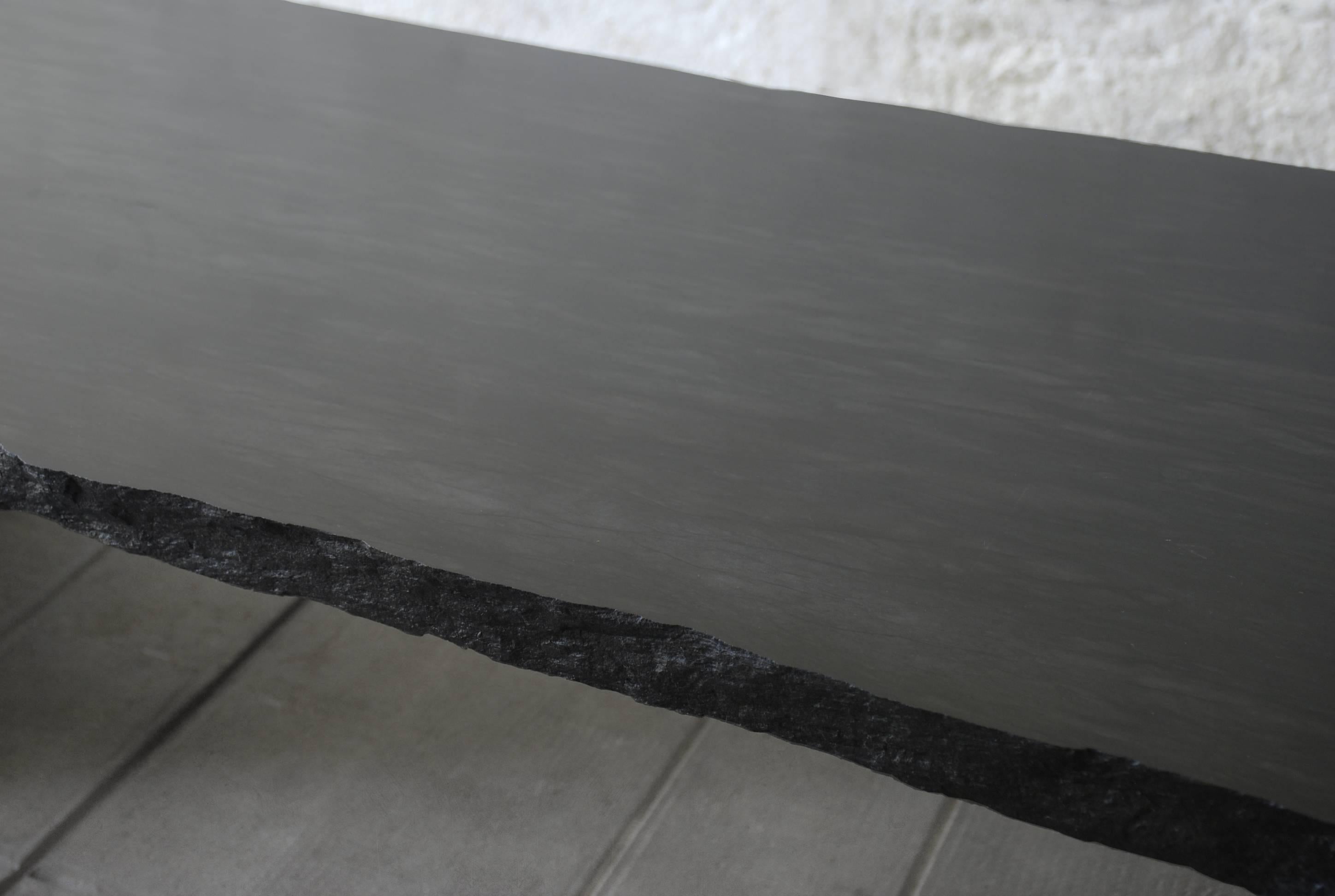 Sculpted marble slate coffee table, Fruste by Frederic Saulou
Designer: Fre´de´ric Saulou.
Materials: Tre´laze´ black slate
Dimensions: W 200 x D 38 x H 50 cm

Edition of 8.
Signed and Numbered.

“While wandering in the streets I have been