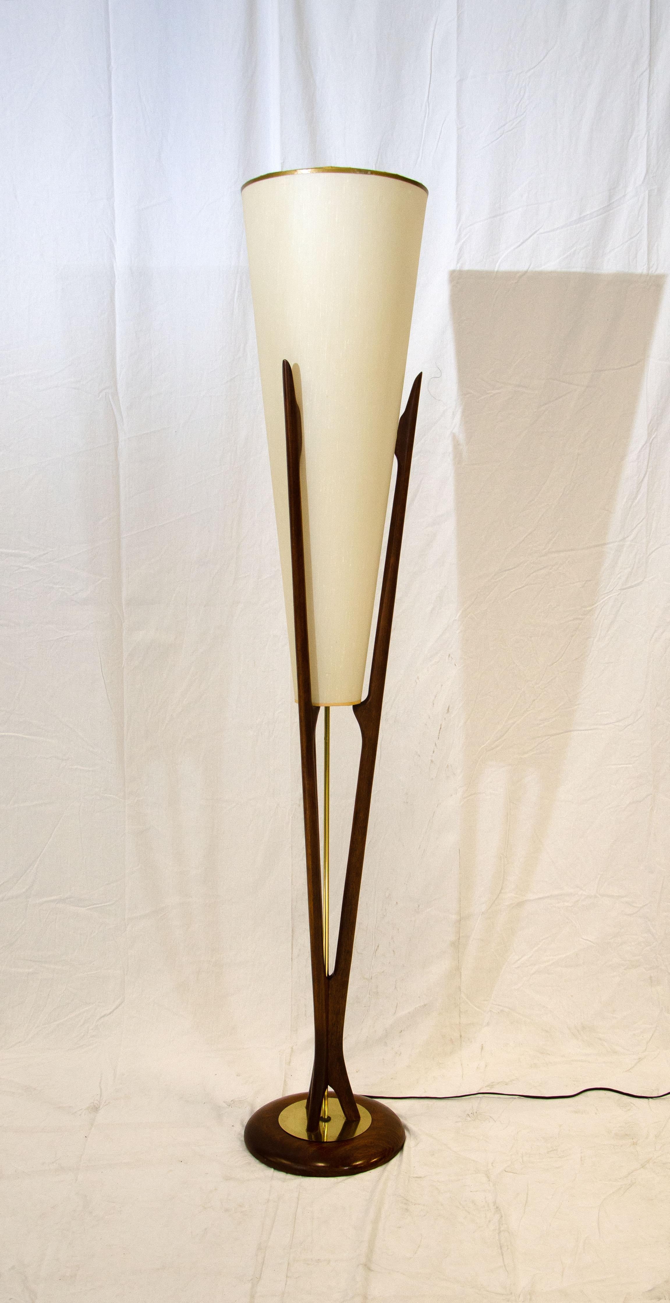 Rare Modeline floor lamp with sculpted walnut frame and original large conical shade which has a textured look. The large shade measures 31 1/2