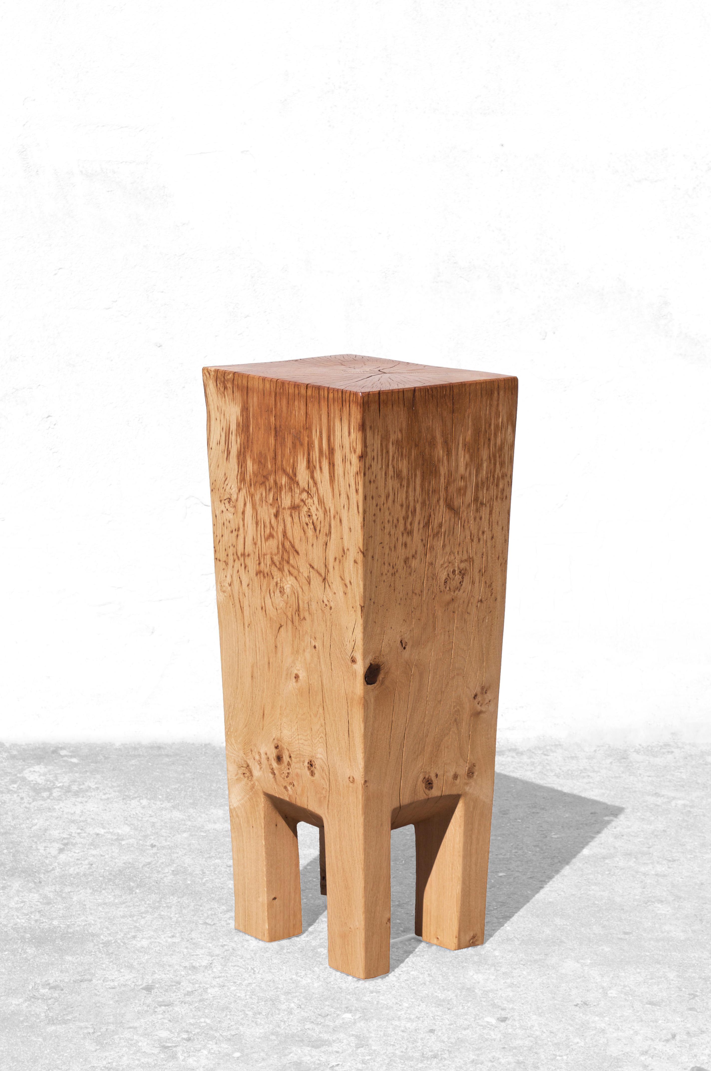 Sculpted side table by Jörg Pietschmann
Dimensions: H 86 x W 34 x D 33 cm 

In Pietschmann’s sculptures, trees that for centuries were part of a landscape and founded in primordial forces tell stories inscribed in the memory of their fibers.

The