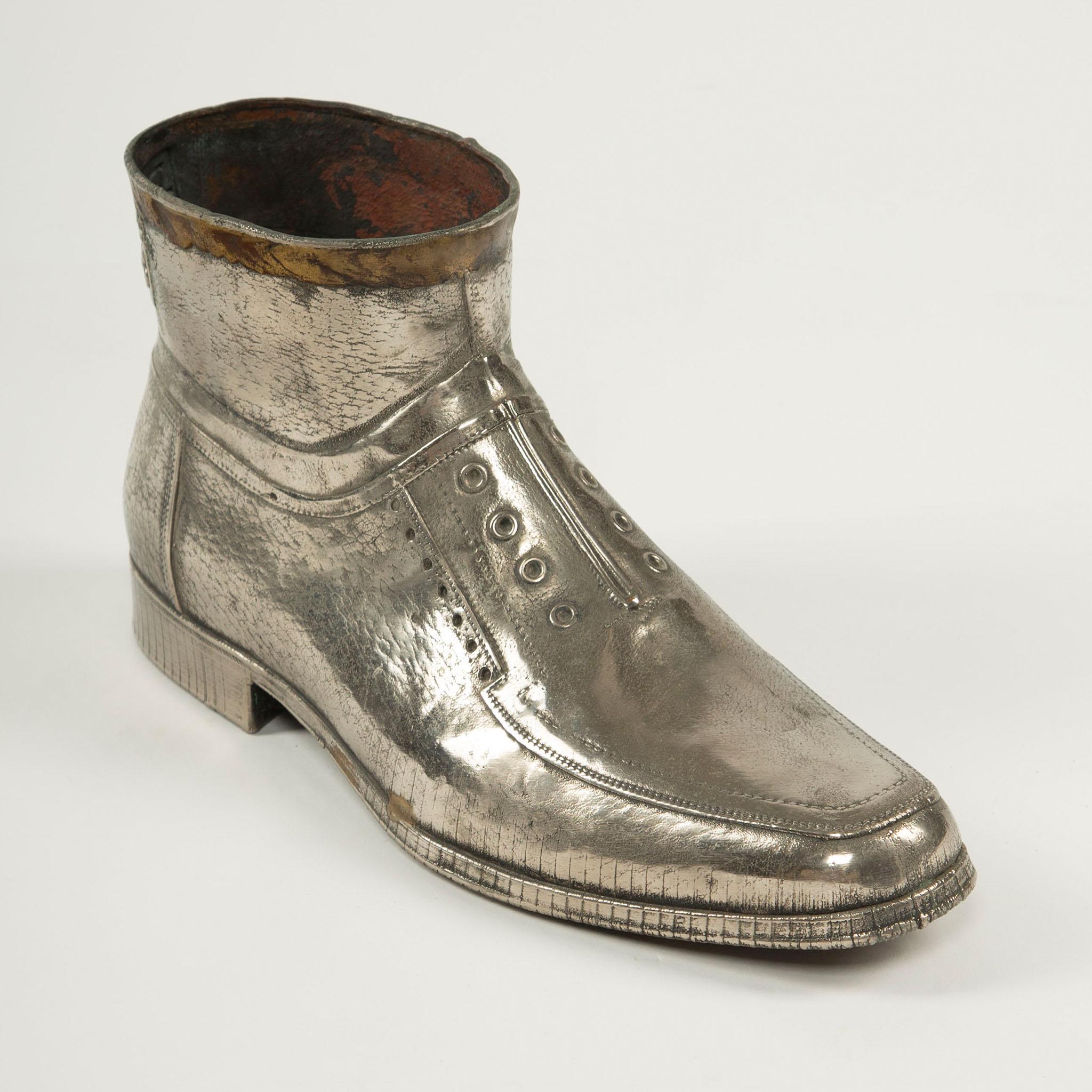 Unique Vintage Metal Boot Sculpture, Dora Foundry, Turkey, Mid-20th Century
A highly detailed vintage sculpture modeled in the form of a desert boot, cast in silvered metal with remarkable attention to texture, stitching, sole, and lace eyelets.