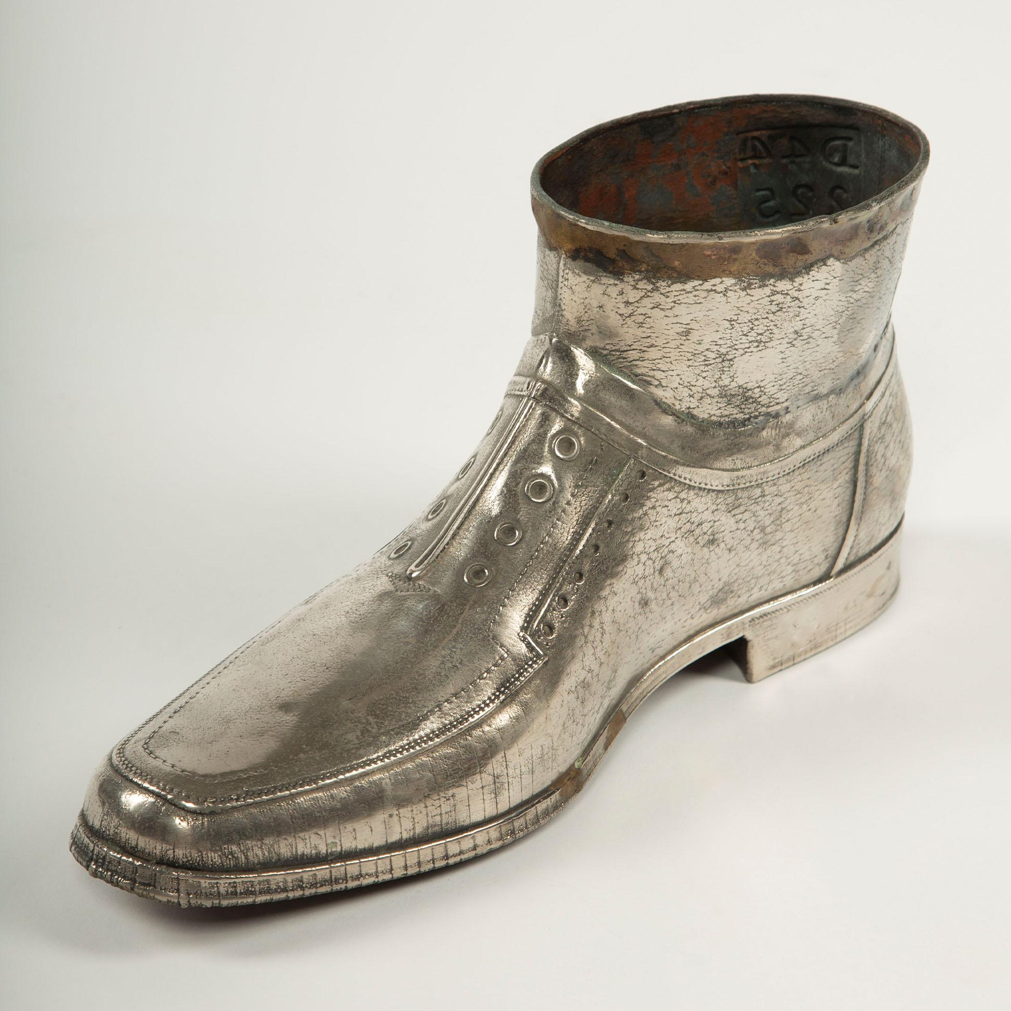 Turkish Sculpted Sole: Novelty Metal Boot with Industrial Markings For Sale