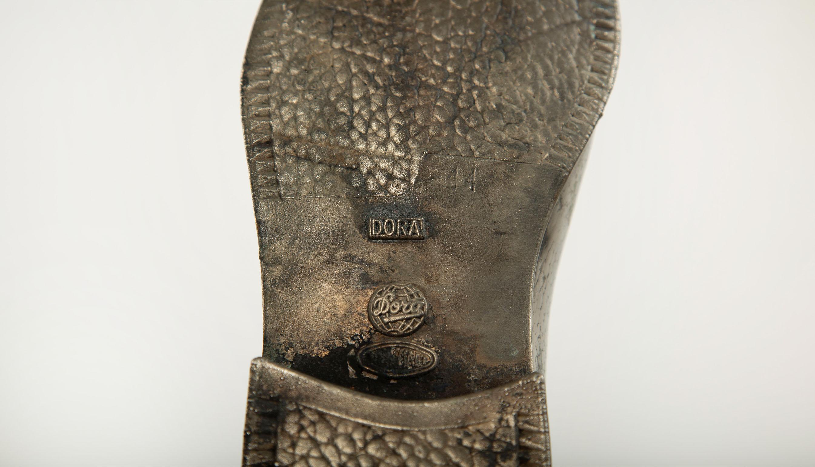 20th Century Sculpted Sole: Novelty Metal Boot with Industrial Markings For Sale