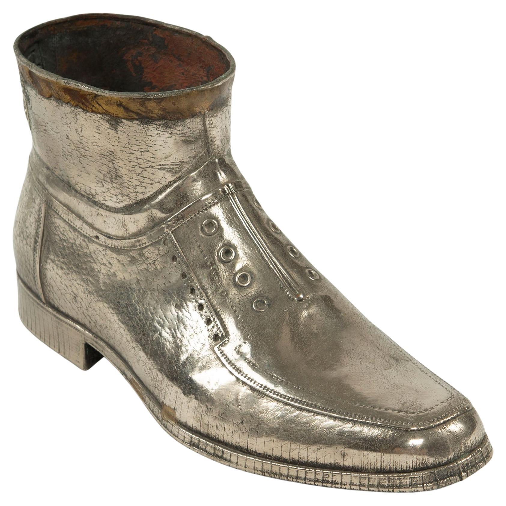 Sculpted Sole: Novelty Metal Boot with Industrial Markings For Sale