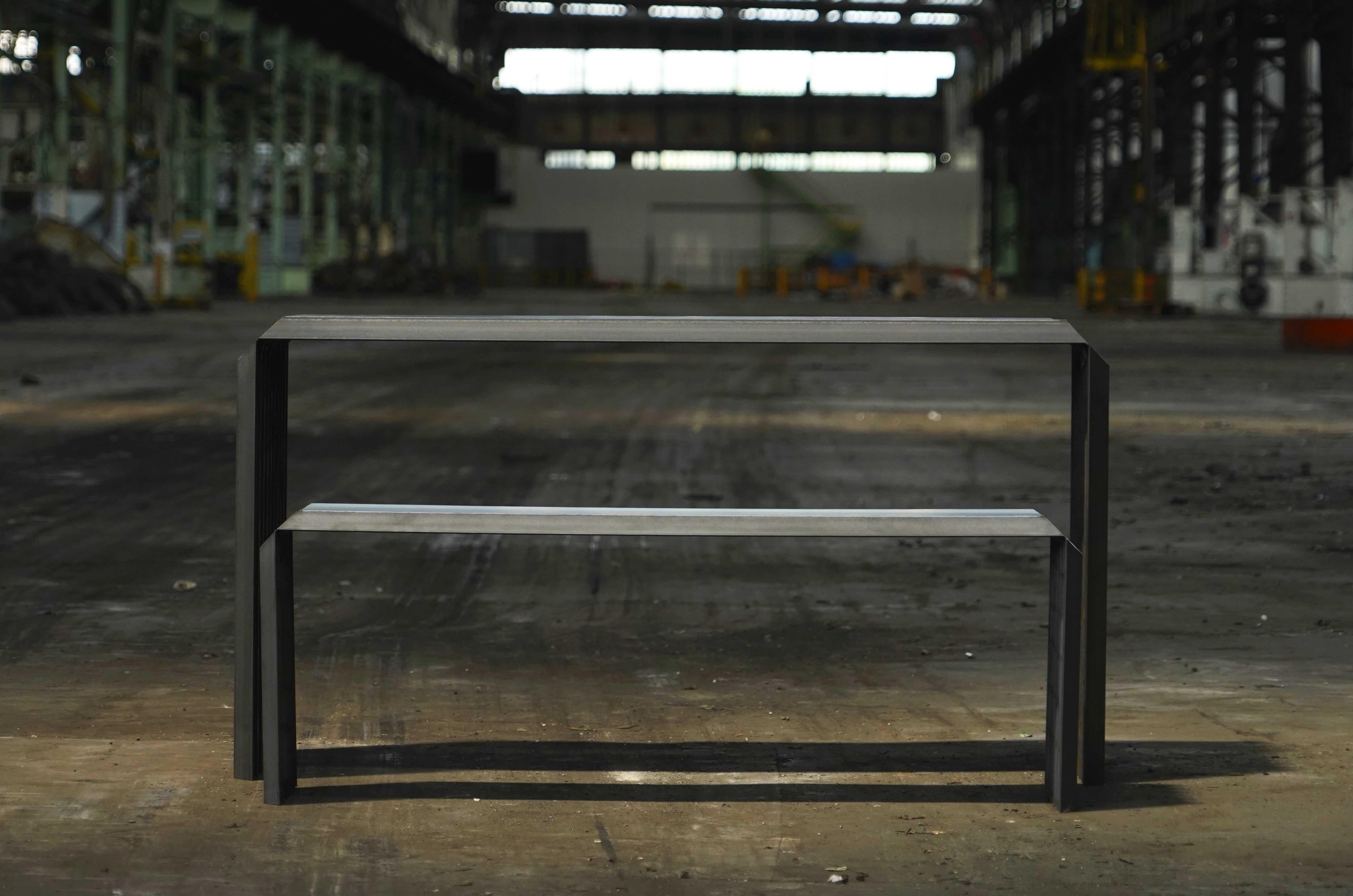 Sculpted steel table and bench by Jules Lobgeois.
Hand-sculpted steel.
Table: L 140 x L 88 x H 55.
Bench: L 120 x L 30 x H 45.

The aim of this new collection is to explore different ways of using metal profiles by interpreting the steel pieces