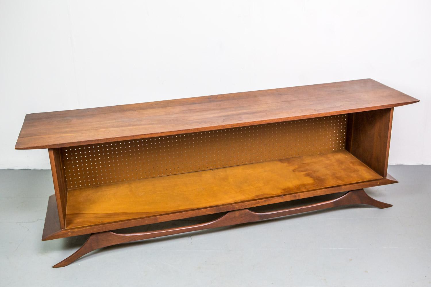 Sculpted studio cabinet, credenza or sideboard in walnut.
This crafted woodworking piece has a Japanese esthetic.