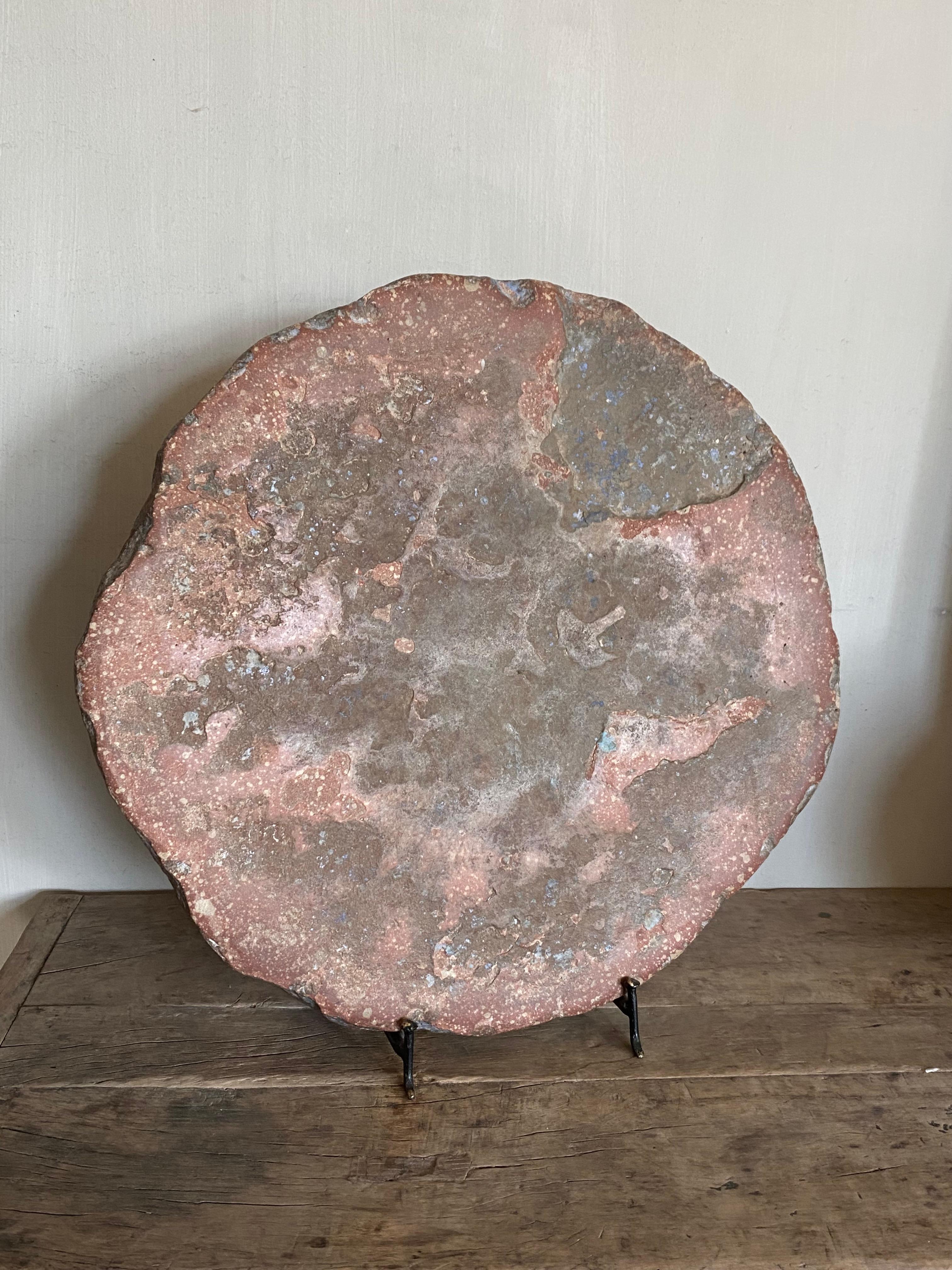 Sculpted natural stone tablet on base.
Beautiful on a custom tripod with an antique character.
A stone that has in its natural palette, shades of pink, blue and gray-brown. A true painting.

We ship safely worldwide, feel free to ask for your
