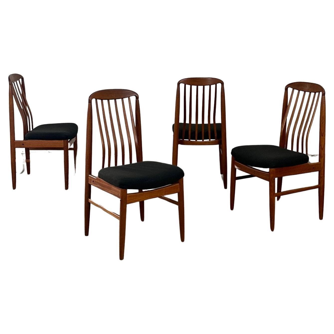 Sculpted teak dining chairs- set of four For Sale