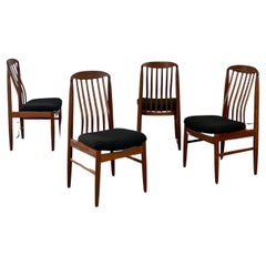 Sculpted teak dining chairs- set of four