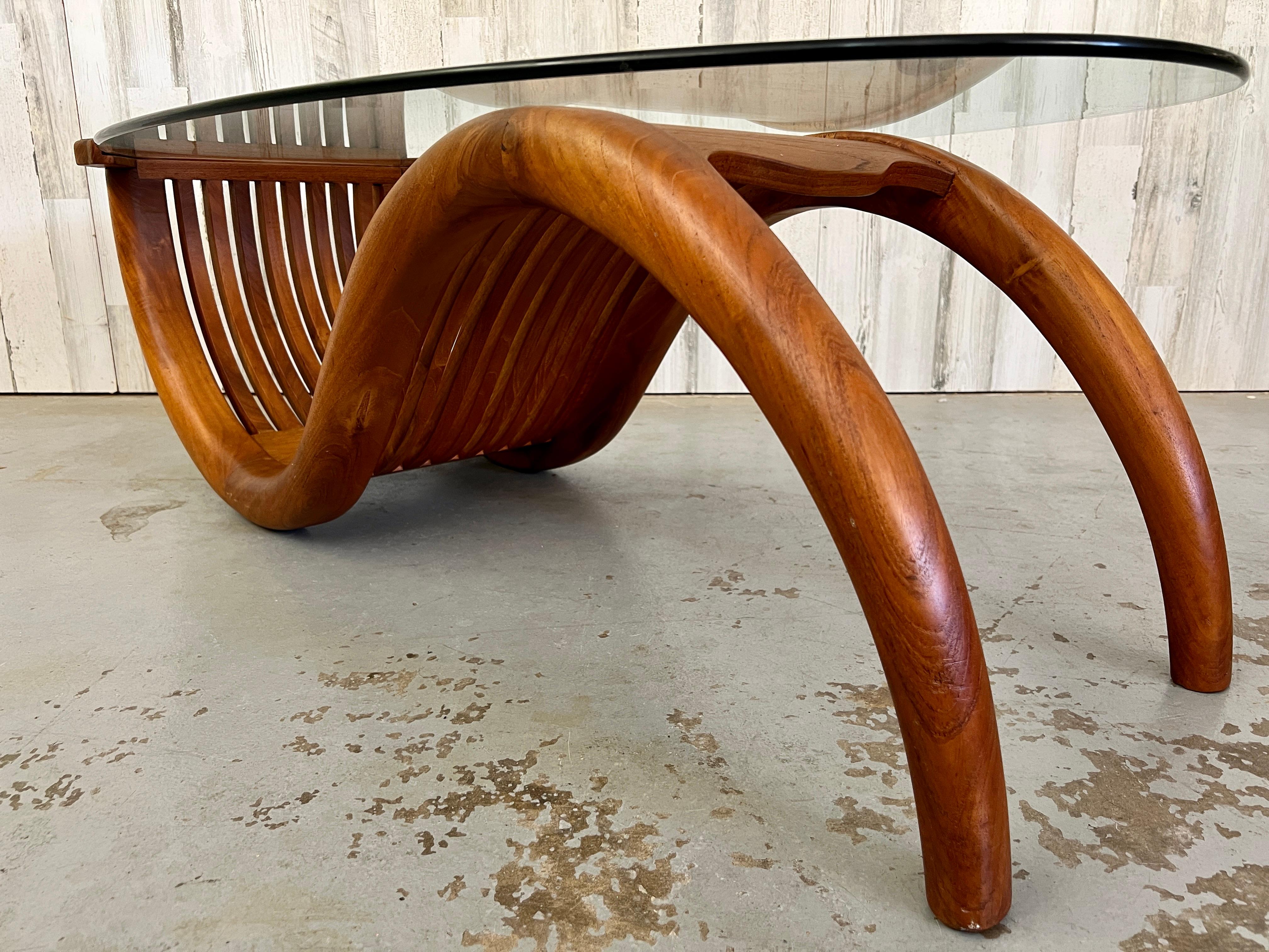 20th Century Sculpted Teak with Oval Glass Coffee Table For Sale