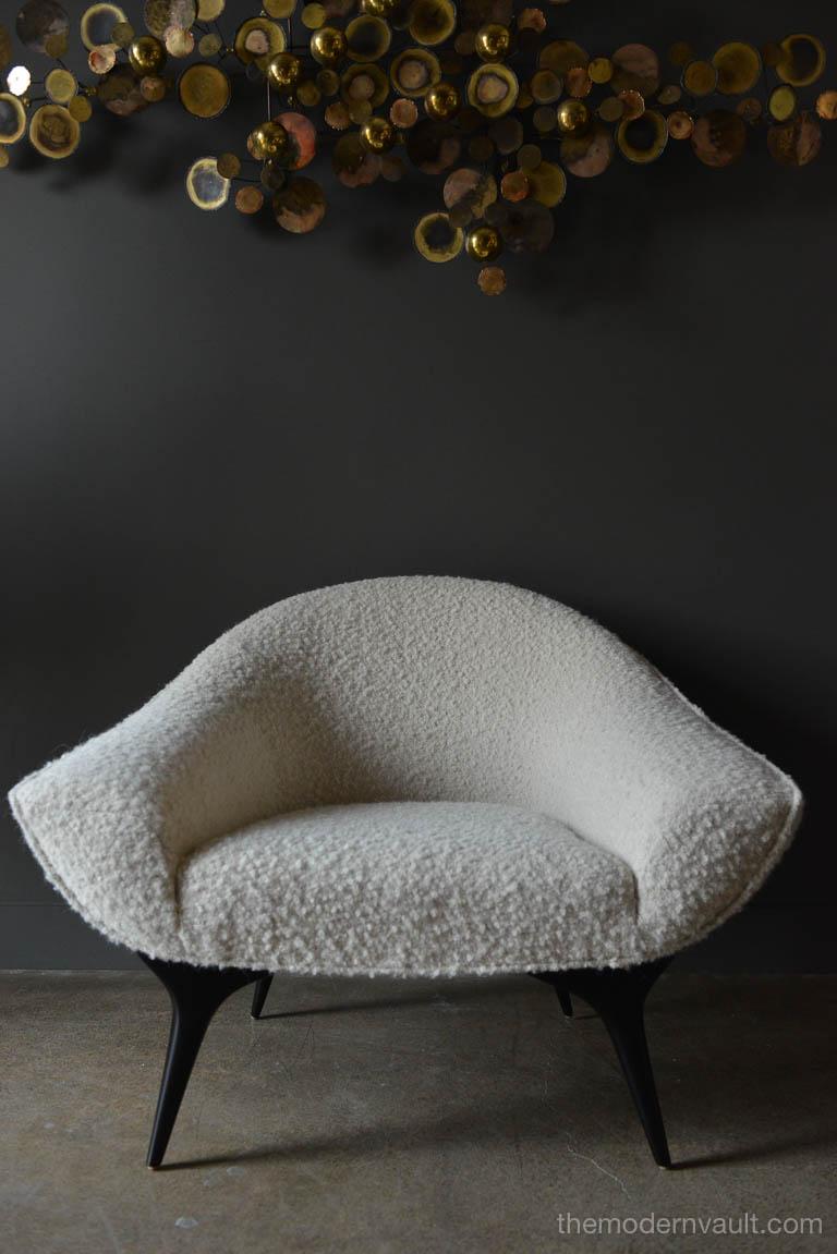 Sculpted tub chair by Karpen of California, circa 1955. Meticulously restored and covered in exquisite ivory textured wool bouclé. Ebonized sculpted legs make this an elegant piece. Delicate, elegant and rare chair fits well into any