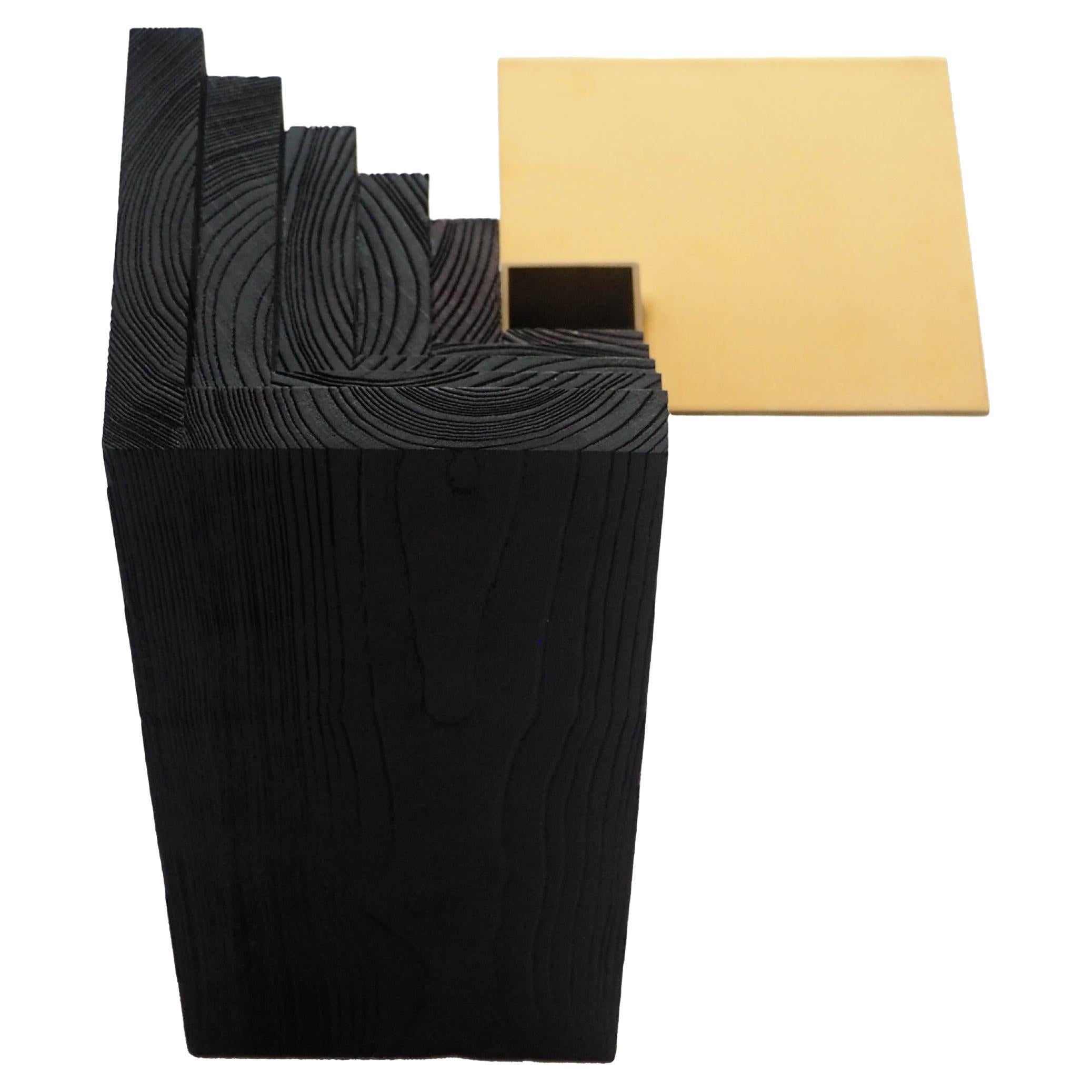 Packaging size and kg: 32cm x 32cm x 42 cm, approx. 8kg

A contrasting structure of solids and voids, an optical illusion that makes you lose sense of what stands further. In plan the wood and the mirrored brass surface form two identical squares