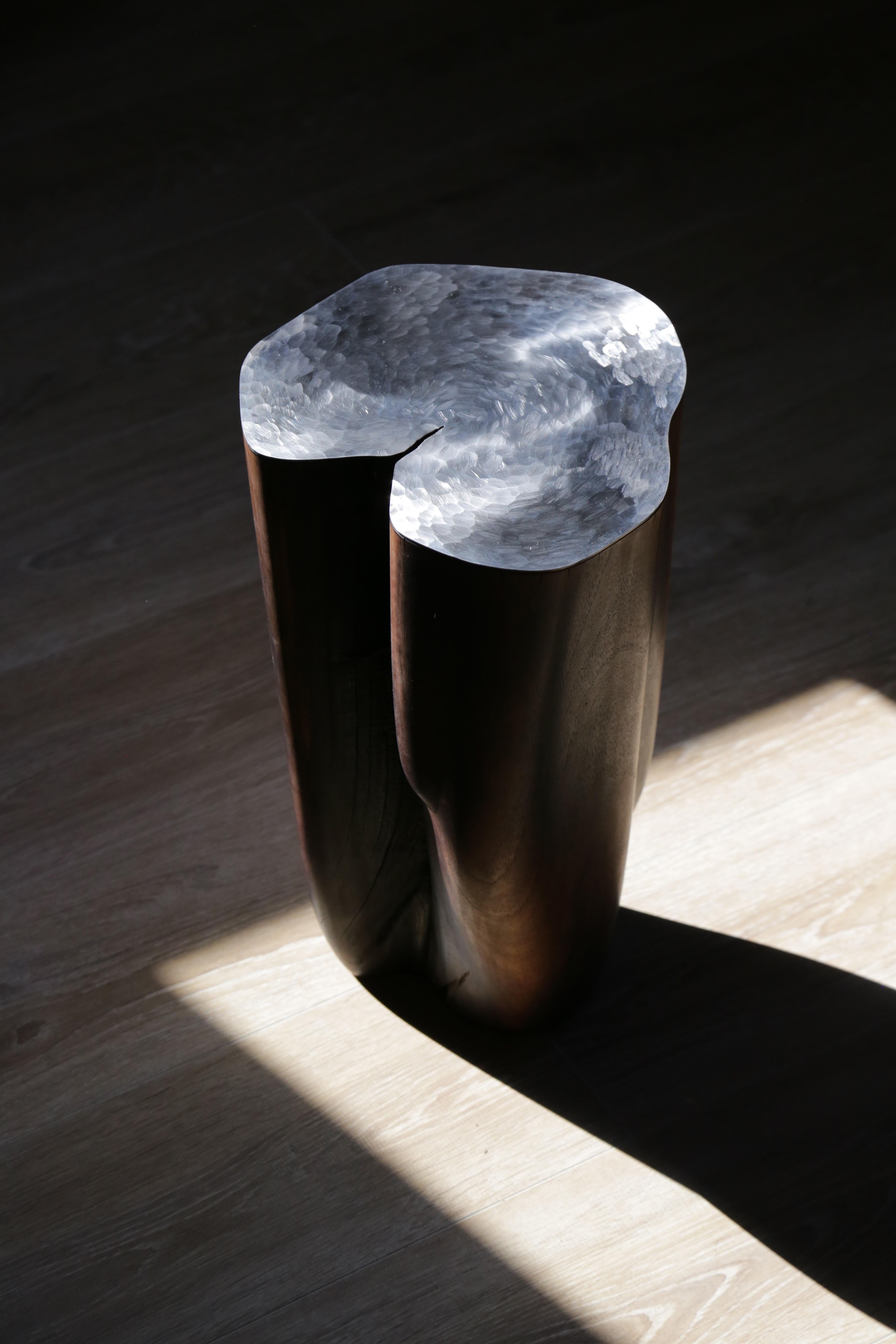 Sculpted walnut and steel side table by Jules Lobgeois
Hand-sculpted steel and walnut
Dimensions: 45 x 28 x 28 cm
European walnut polished with beeswax and varnished steel. 

Jules Lobgeois

French contemporary designer. Over the years, his studies