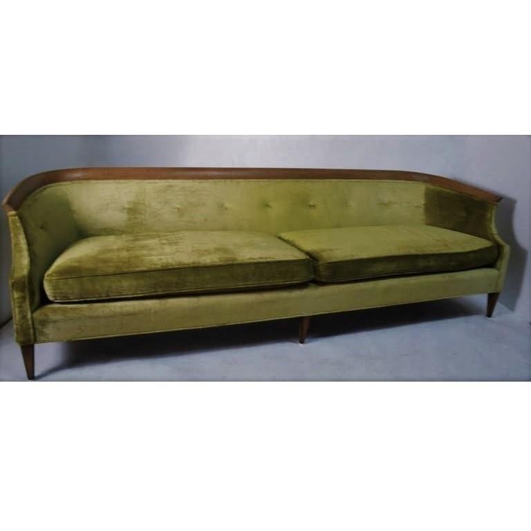 Vintage 1960s walnut sofa with curved back designed by Erwin Lambeth for Tomlinson Furniture Co. The exquisite woodwork is apparent in the sculpted walnut that crowns the sofa and follows the frame's elegant, inward curve. Professionally upholstered