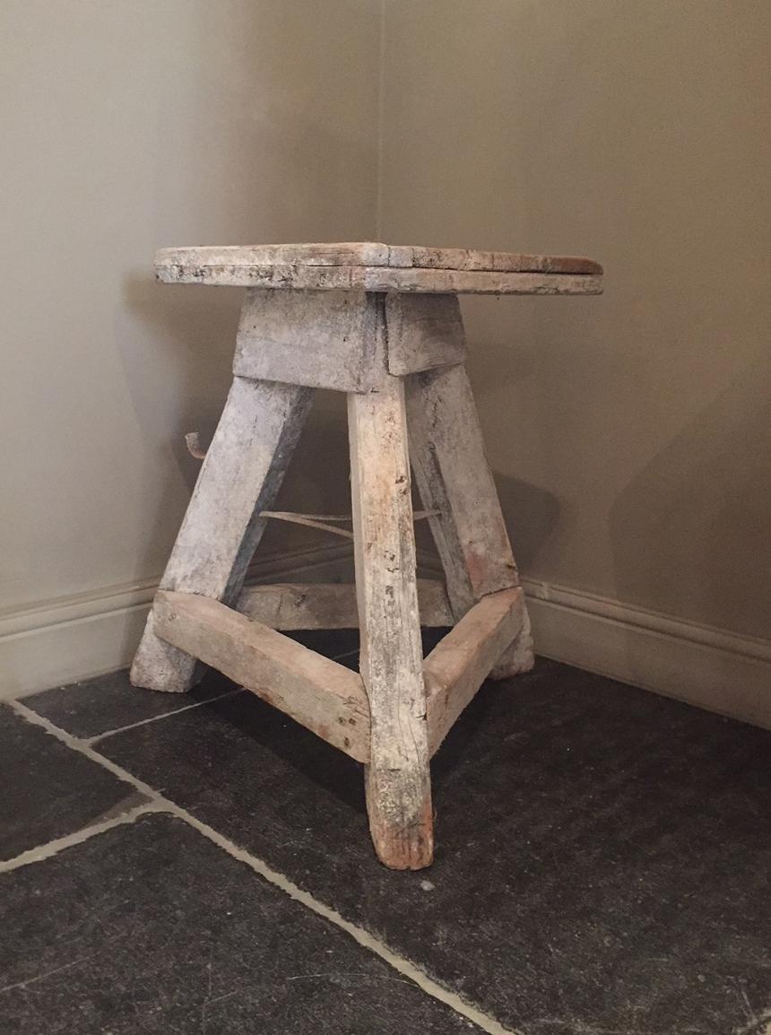 Italian sculptors stand with great patina. Made from softwood with iron reinforcements and retaining its original paint and chalk traces.