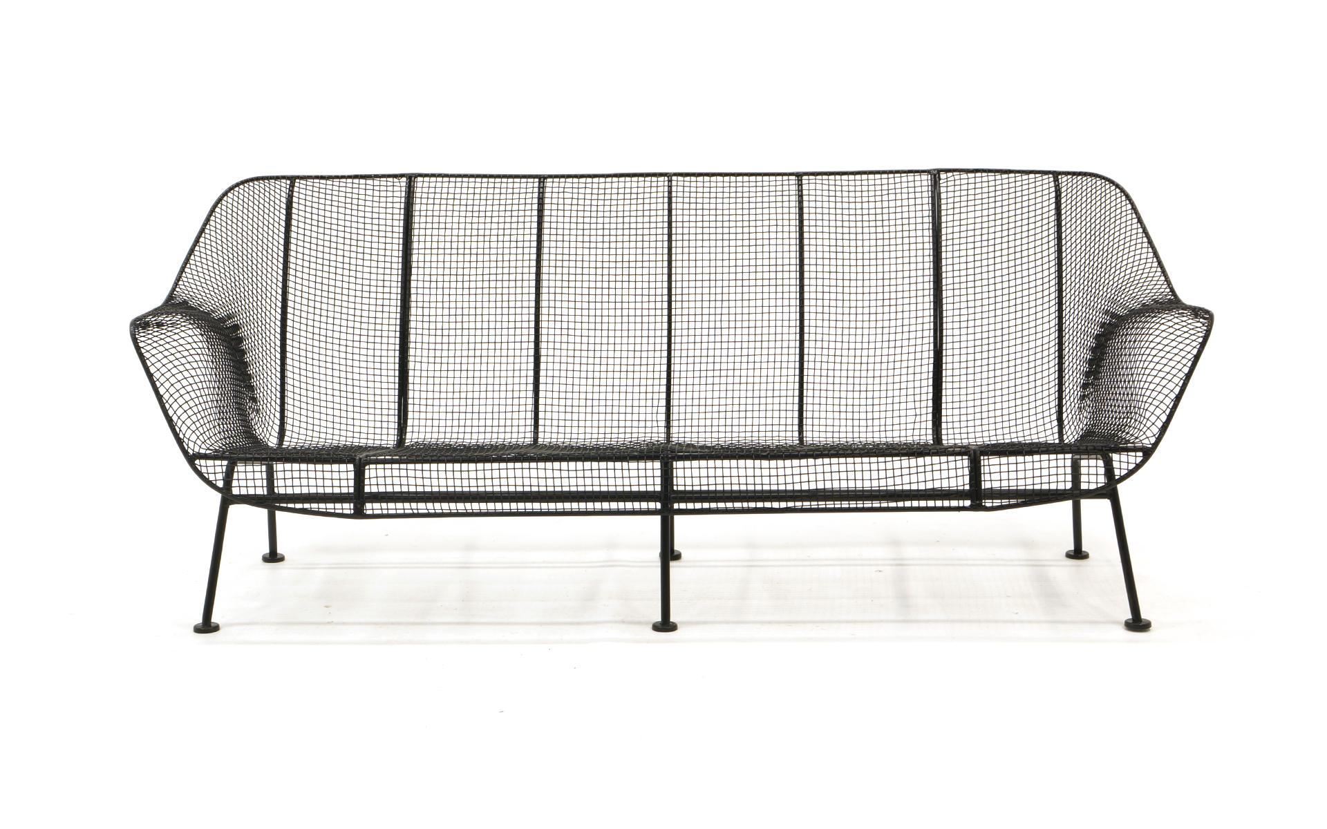 Sculptura patio sofa designed by Russell Woodard for Woodard, 1950s. Woven wire with wrought iron frames, these have been professionally media blasted and powder coated in a satin black finish. Beautiful and ready to use.