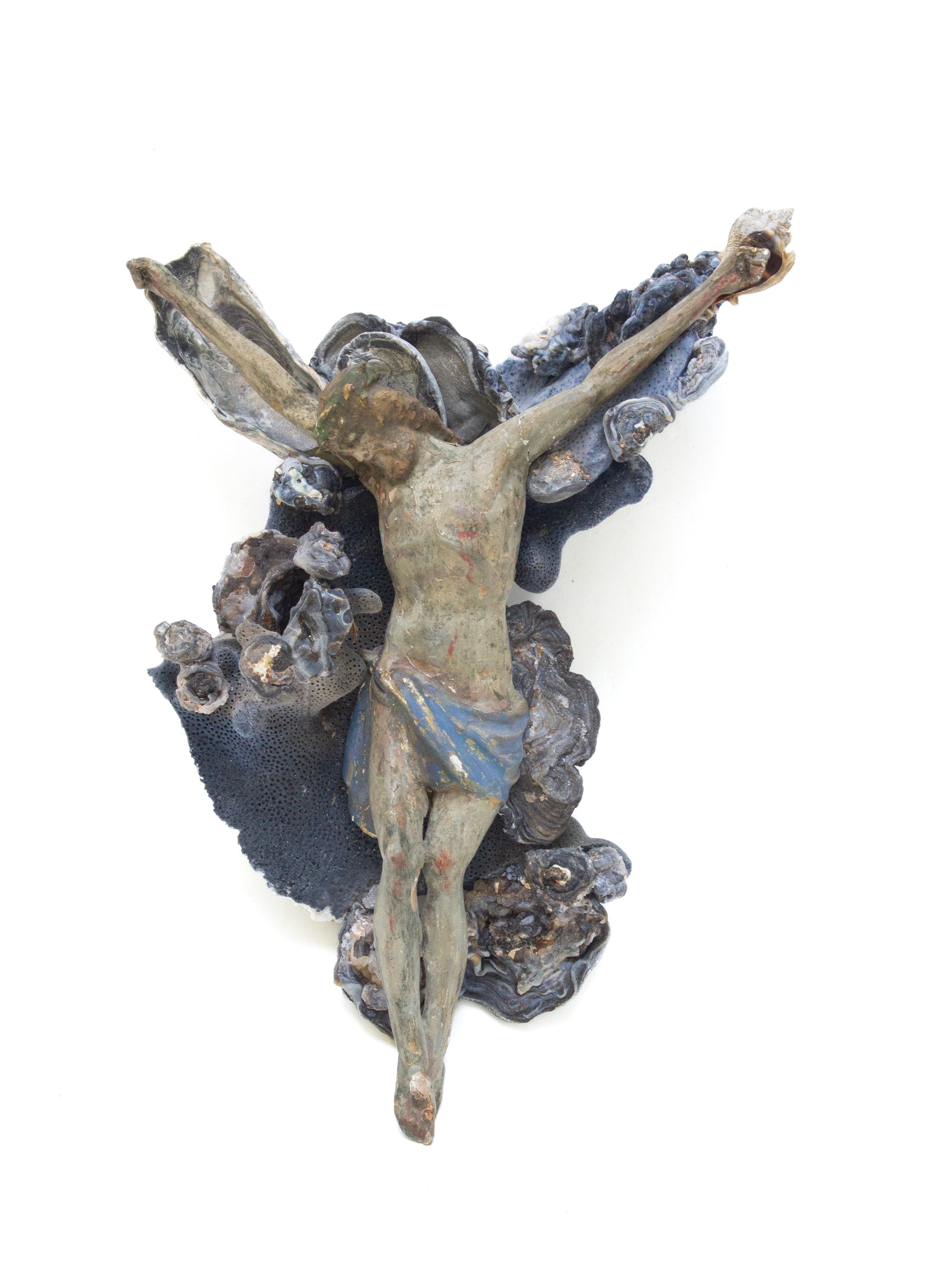 18th century Italian hand-carved figure of Christ wrapped in blue coral and chalcedonian rosettes. The figure of Christ originally came from a crucifix from a historic church in Tuscany. It is now a sculptural depiction that is reminicent of