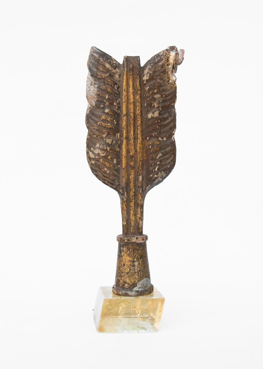 18th-century distressed Italian mecca gilt arrow with a baroque pearl on a polished calcite base.

The arrow was once part of a decorative motif in an artistic depiction in historic Italian church. The piece shows the tail of the arrow which