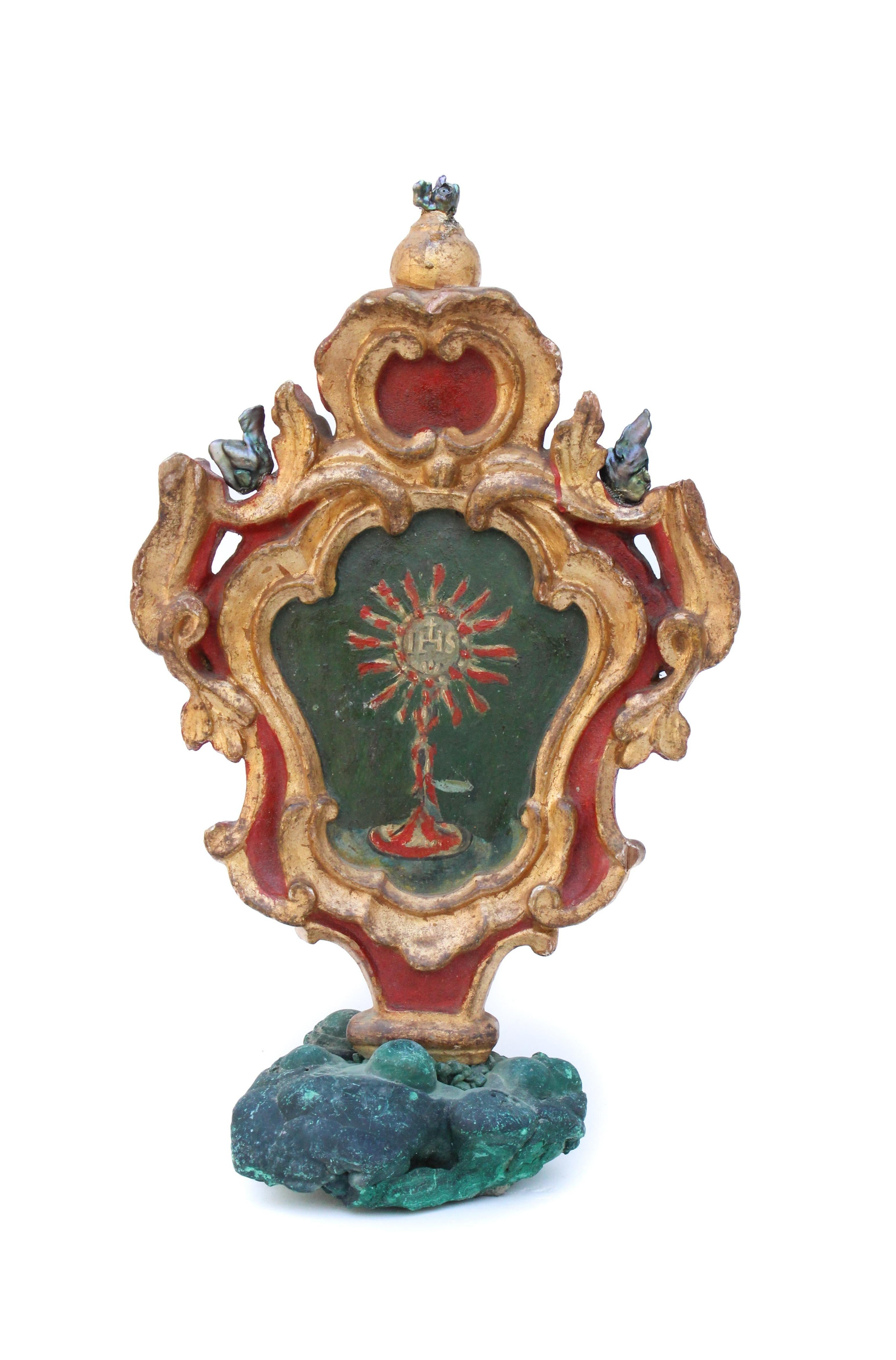 18th century Italian gilded and hand-painted processional finial with baroque pearls and mounted on malachite. The piece was originally part of a processional pole from a historical church in Italy. A eucharist is painted on one side and Mary is