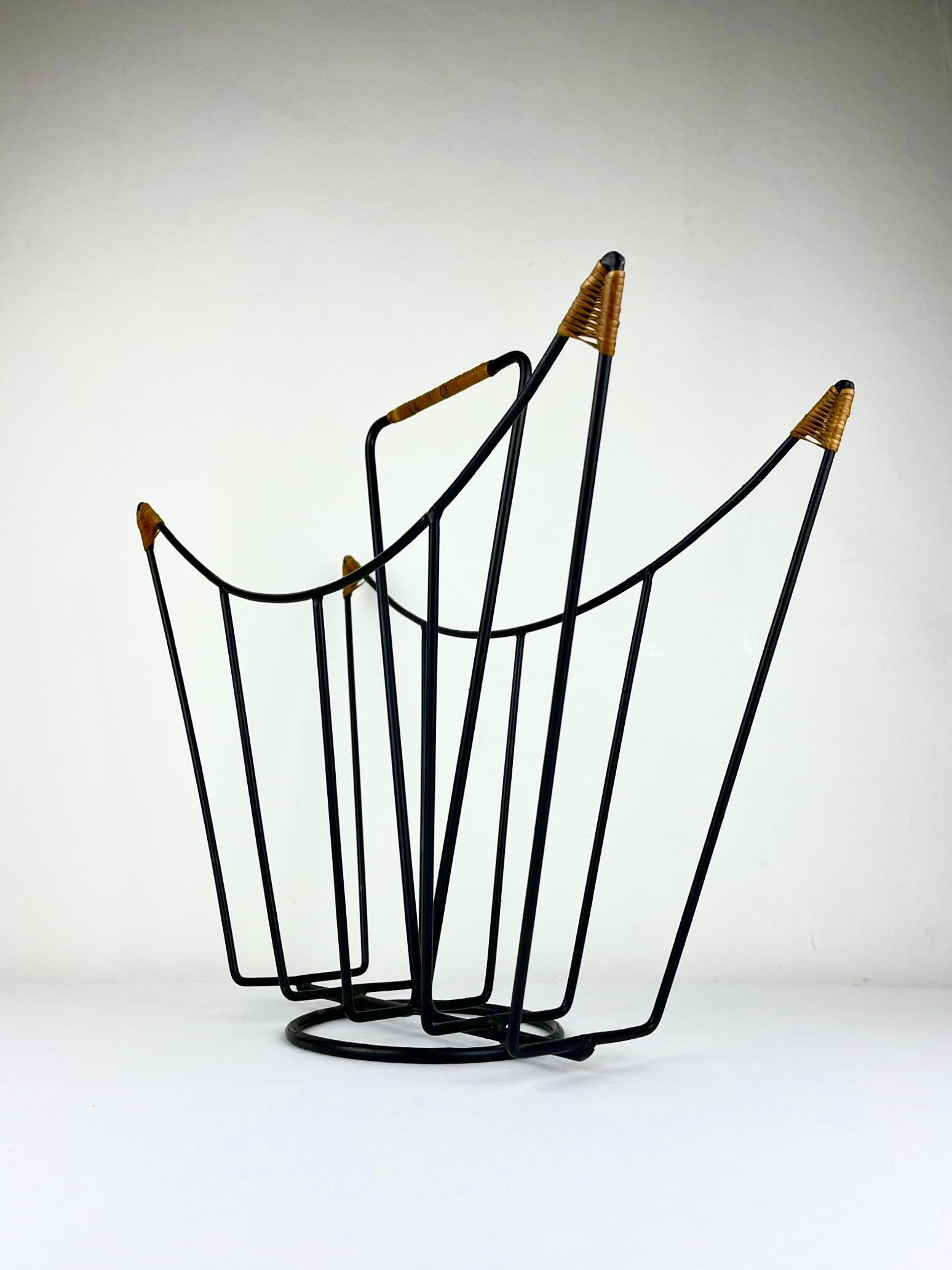 Sculptural 1950s metal magazine rack with twisted rattan details Laurids Lonborg For Sale 1