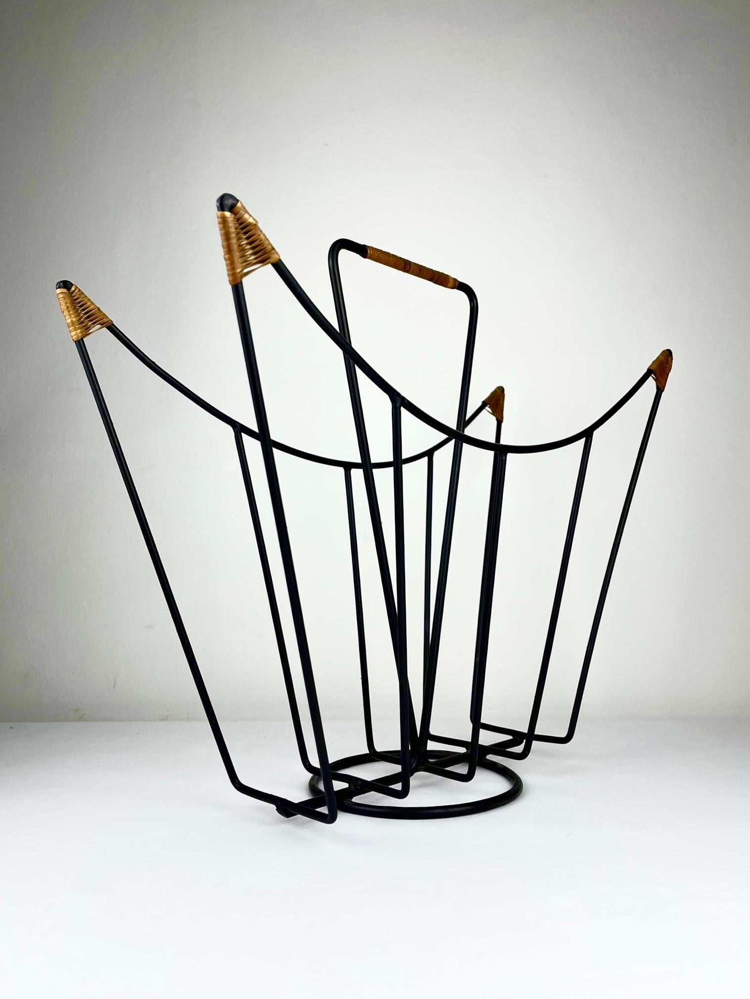 European Sculptural 1950s metal magazine rack with twisted rattan details Laurids Lonborg For Sale