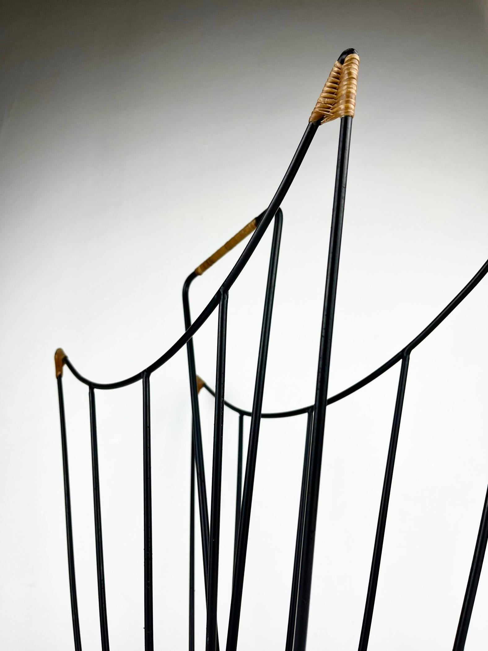 European Sculptural 1950s metal magazine rack with twisted rattan details Laurids Lonborg For Sale