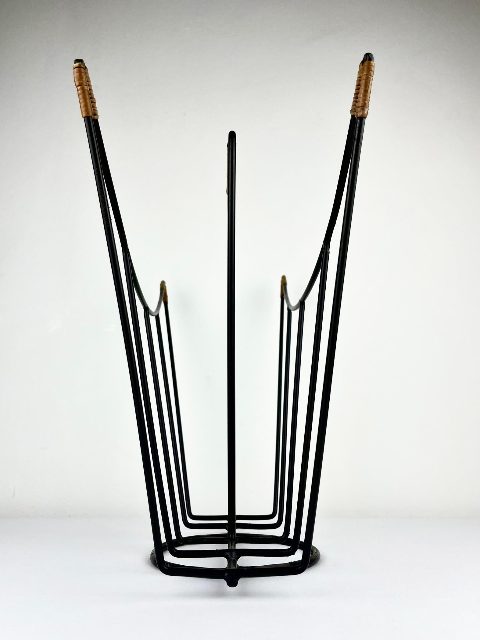 Sculptural 1950s metal magazine rack with twisted rattan details Laurids Lonborg For Sale 1