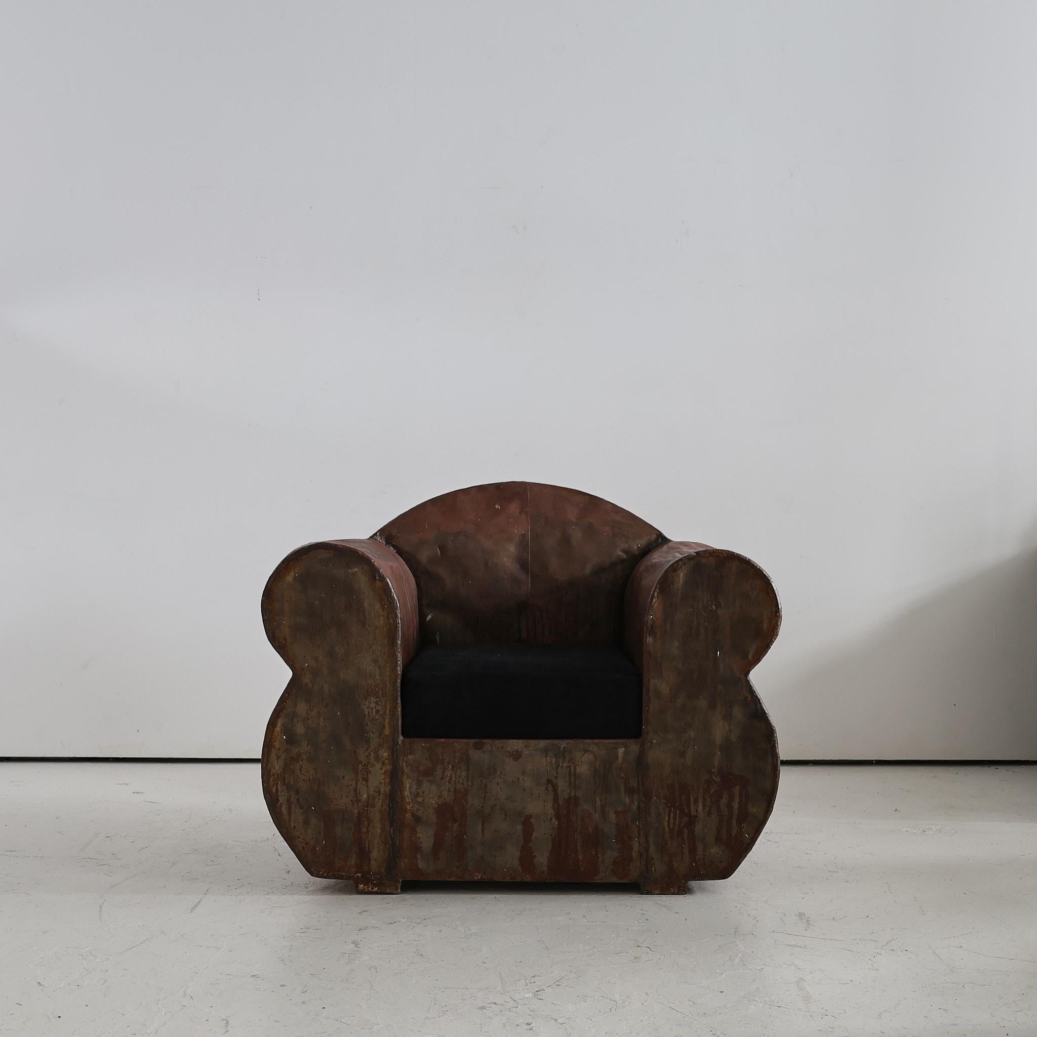 An oversized 1970s French artist made club chair in sheet steel.

Heavily patinated with beautifully thick welds visible throughout.

Recently added oversized black suede seat.

Stylistically more than slightly similar to the work of British