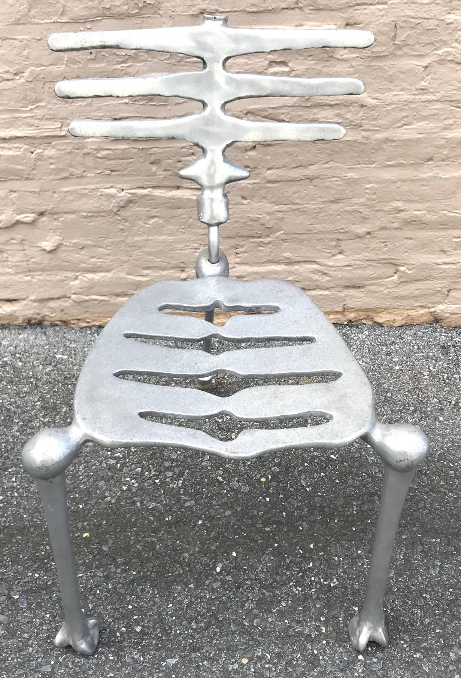 Sculptural heavy cast aluminium skeleton chair from the 1980s-1990s designed by Michael Aram. Wonderful details throughout!