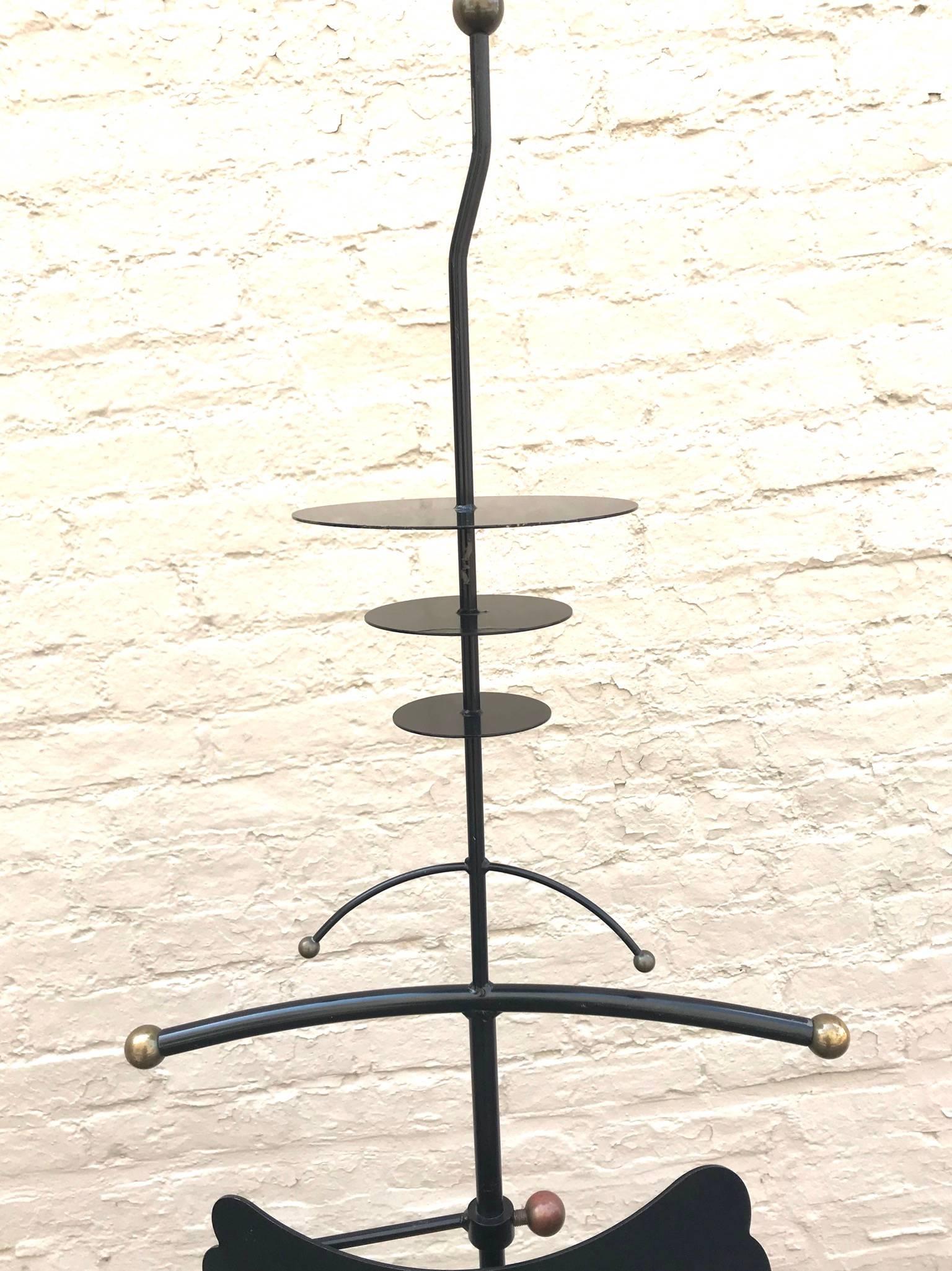 Tall 1980s Memphis era Italian telescoping valet stand in enameled wrought iron with brass ball finial detail.