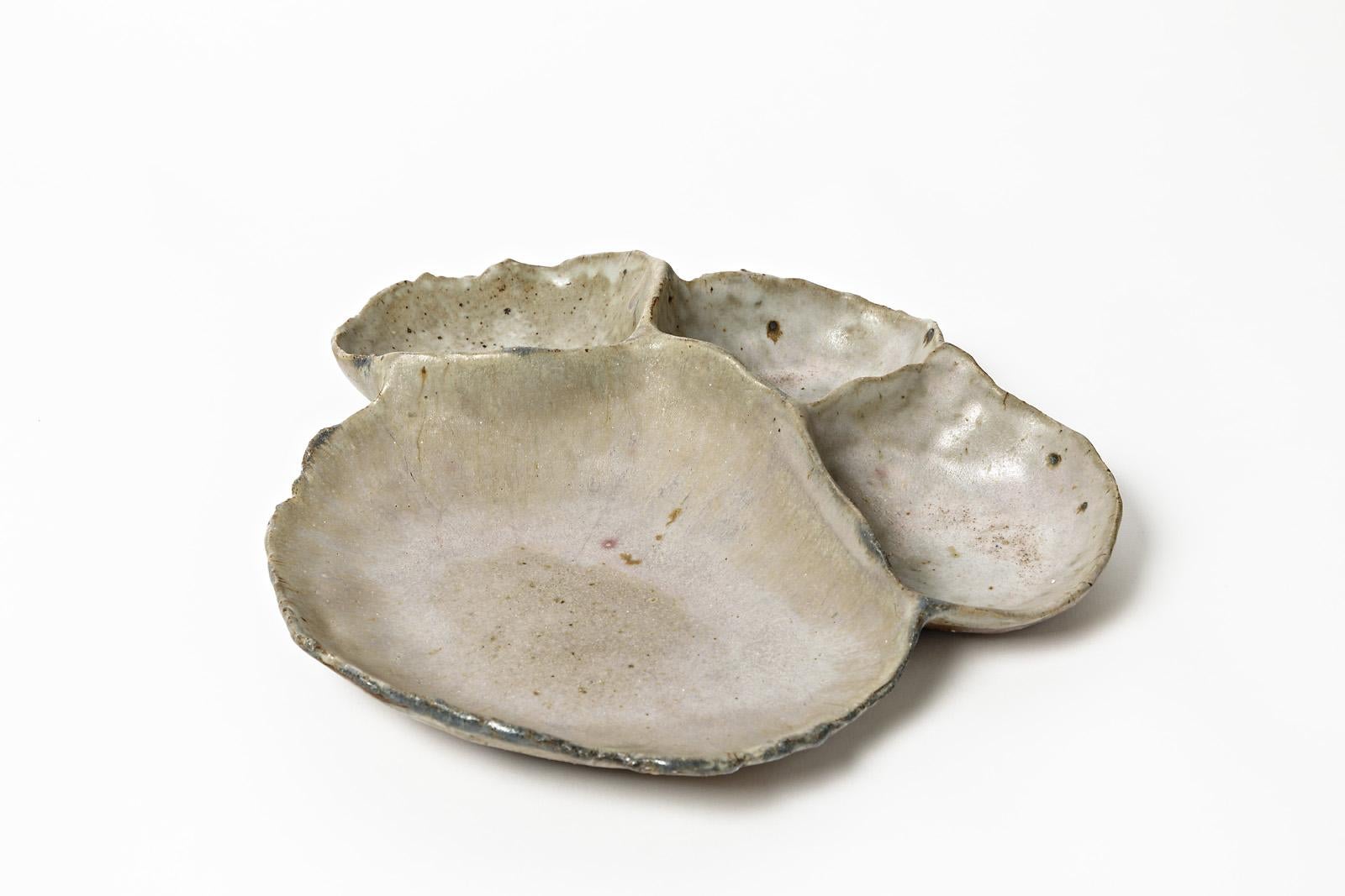 Catherine Mathieu

French stoneware ceramic plate by the French artist, circa 1975.

Decorative and elegant abstract ceramic sculpture for the table or a wall.

Perfect original conditions

SIgned under the base

Elegant light grey ceramic