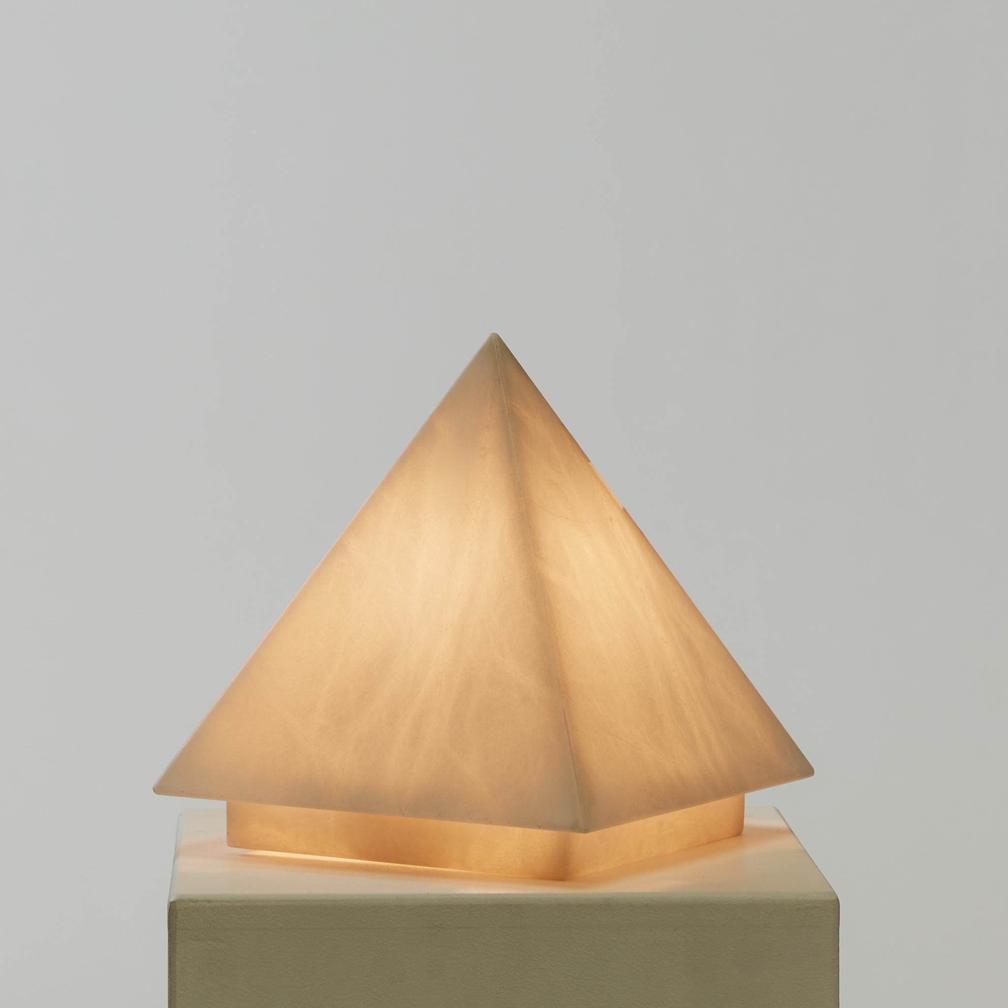 An alabaster pyramid shaped lamp, with a diffused light and rewired with cream silk flex.

PAT tested with new UK plug. 

Period: Circa 1970's

Material: Alabaster

Dimensions: H25 x W23 x D23cm

Condition: Vintage condition - no chips or