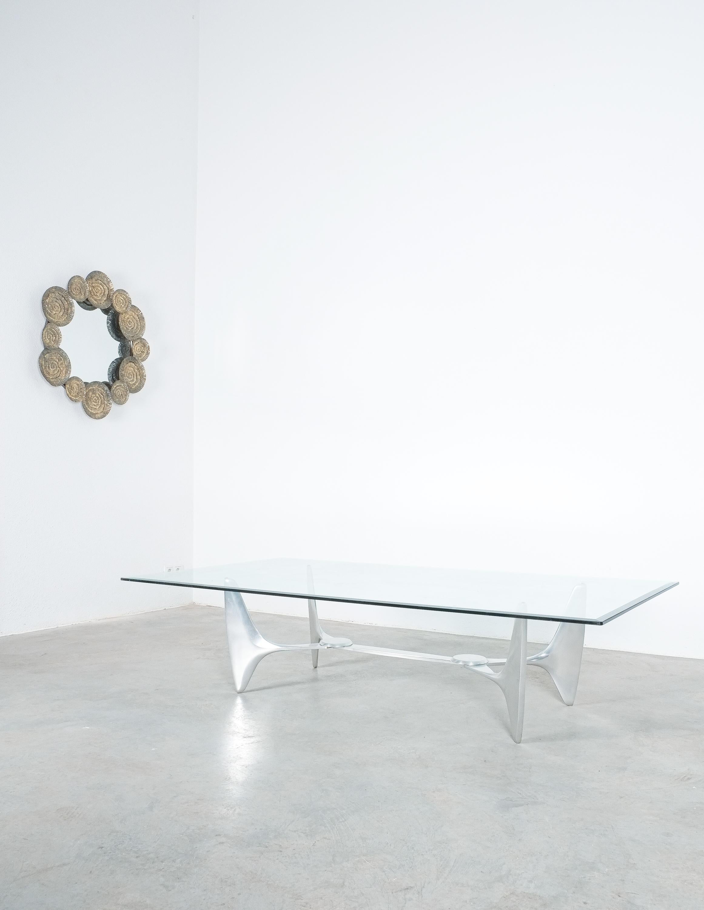 Coffee or cocktail table by Knut Hesterberg produced by Ronald Schmitt, Germany circa 1960. It is composed of cast aluminium parts and is in good condition. The table base will be disassembled for shipping purposes. The table top measures 70