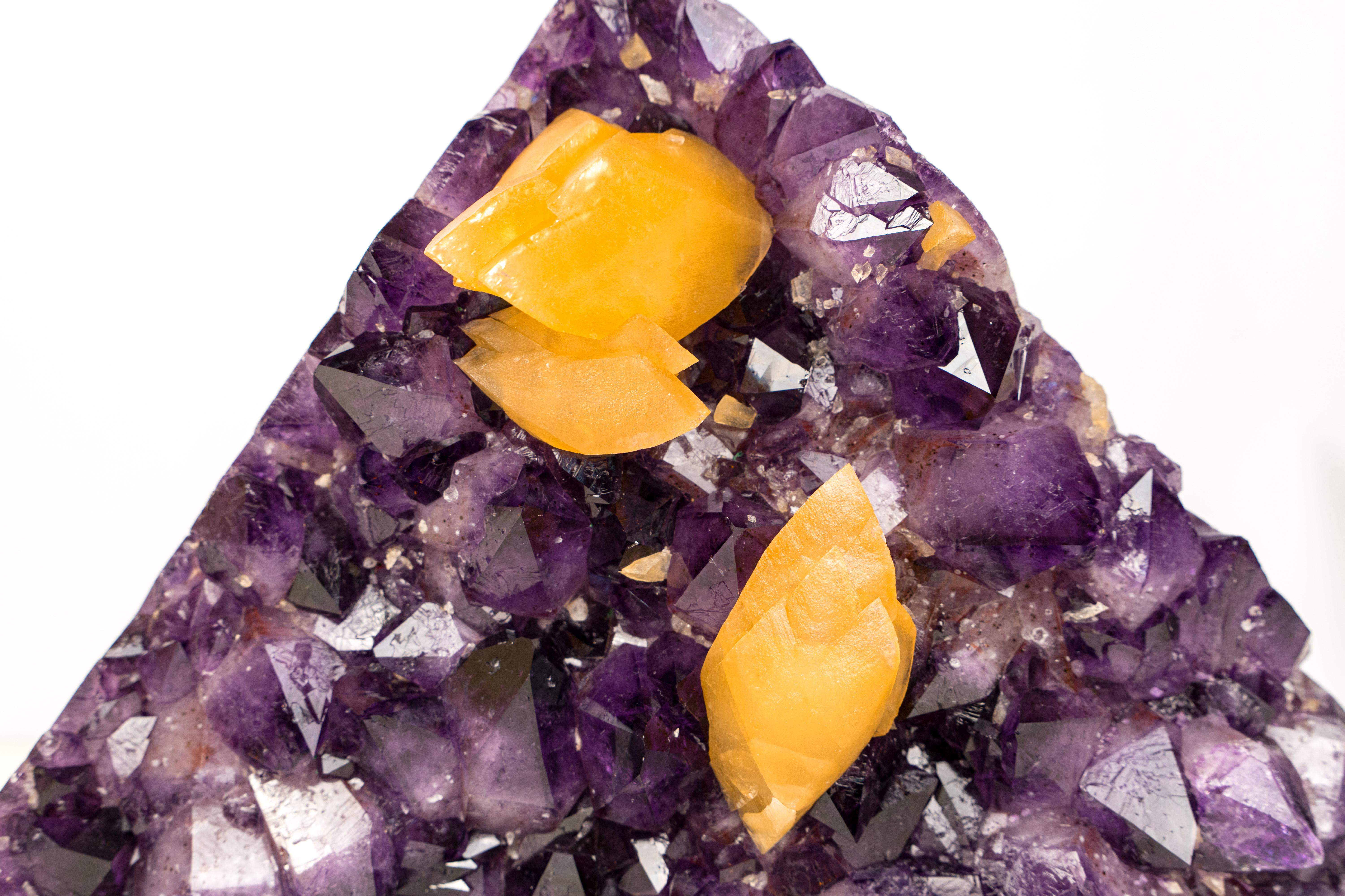 Sculptural large Amethyst with orange scalenohedral Calcite growing over deep purple Amethyst crystals.

▫️ Description

Stunning at first sight and highly aesthetic, this Amethyst cluster features rare orange scalenohedral Calcite crystals growing
