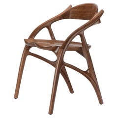 Sculptural and flowing Wapiti Chair in Claro walnut by Erickson Woodworking