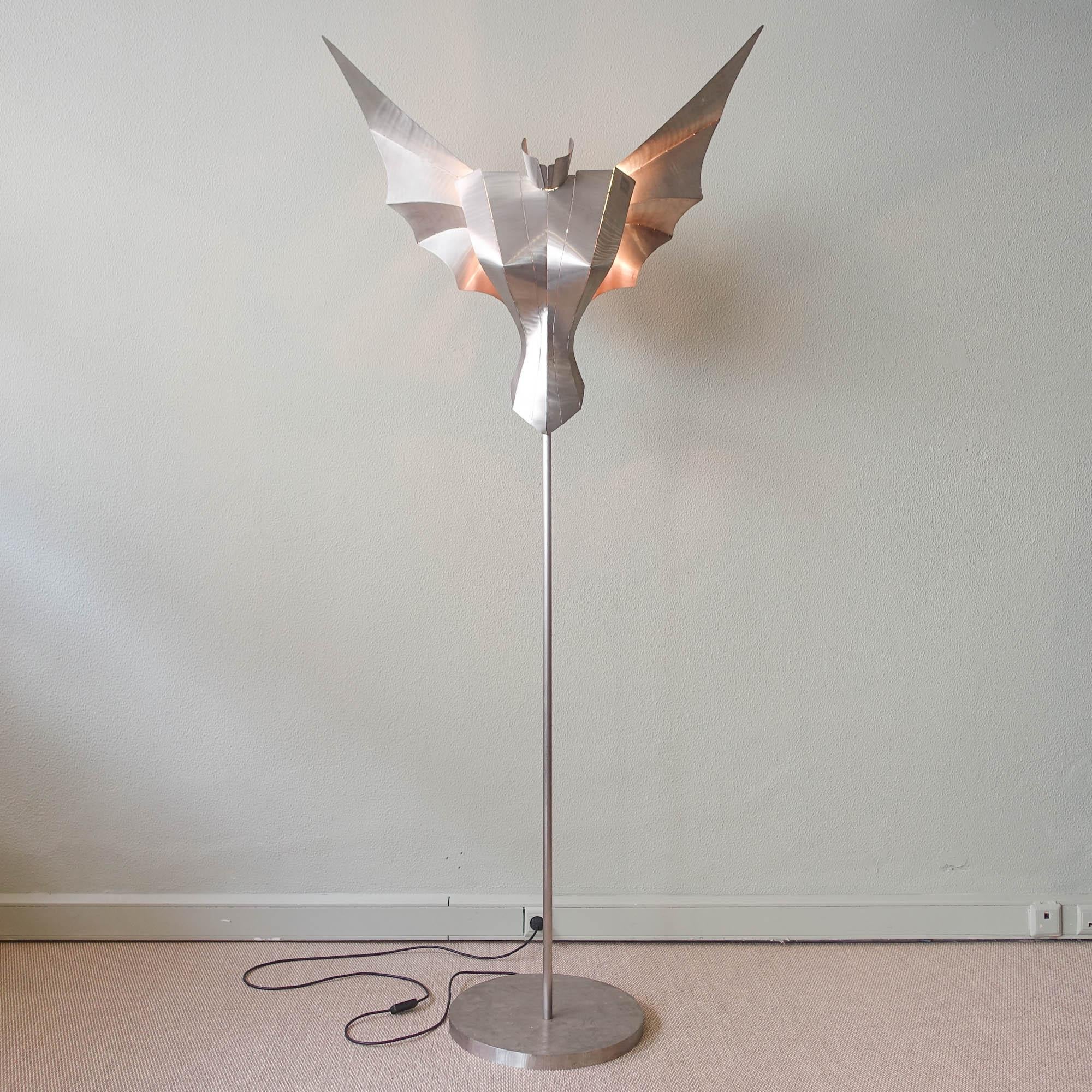 A unique floor lamp / lighting object designed by Reinhard Stubenrauch for Stubenrauch Lichtobjekte in Berlin, Germany, circa 1990's. This piece, model Angel, has an impressive design made of stainless steel in the shape of an angel. It is handmade