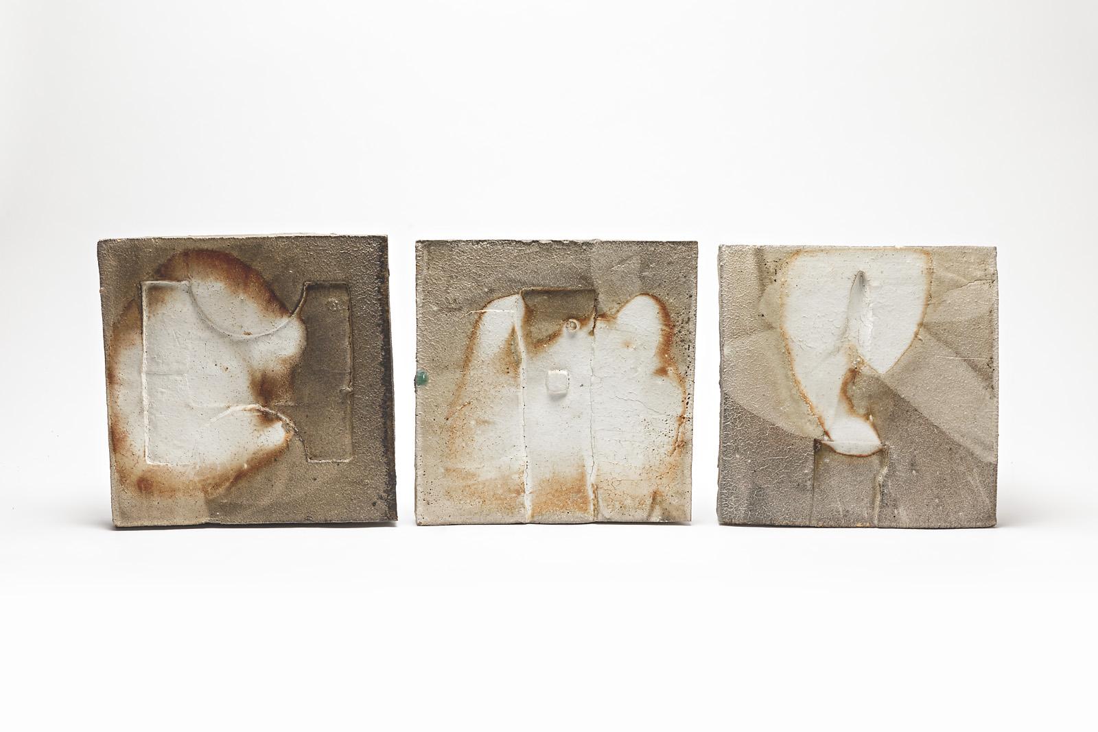 Architectural and sculptural triptych ceramic wall panel.

Set of three stoneware panel with firing effects.

Realised in la Borne, famous french ceramic place.

The three forms are anvil footprint.

We can make sereval on order with different color