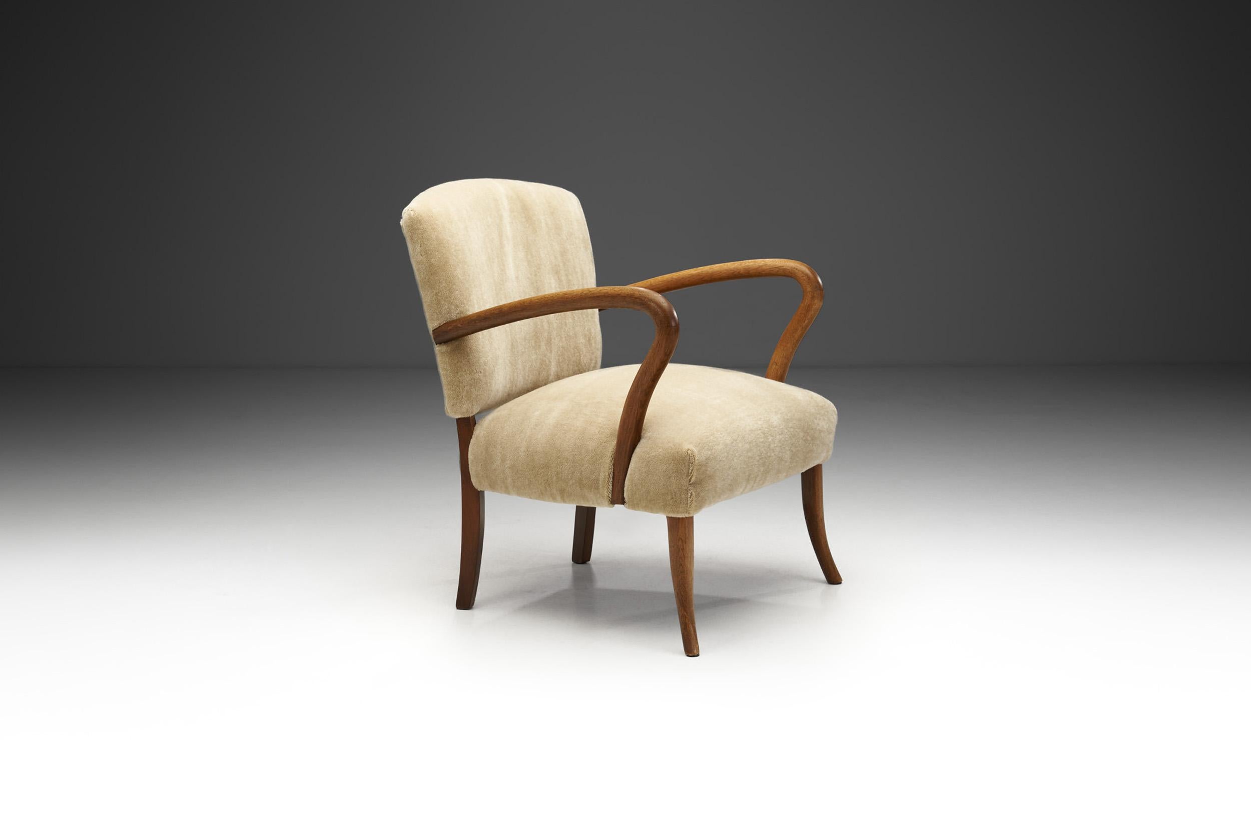 Mid-Century Modern Sculptural Armchair with Curved Arms, Europe ca 1950s For Sale