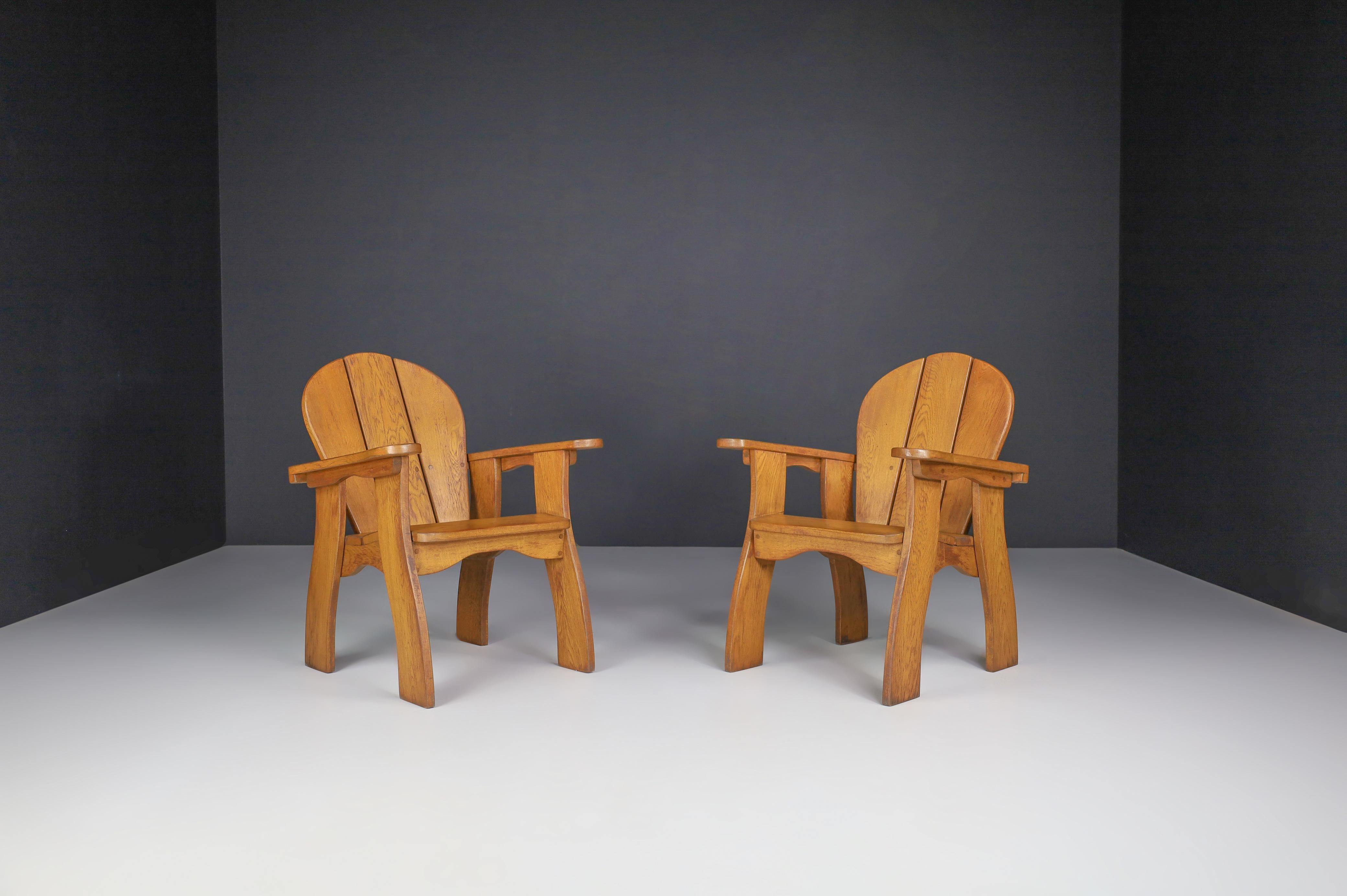 Set of two sculptural armchairs in oak, France, 1960s.

Set of two sculptural armchairs, these chairs are made of French oak and sculpturally crafted by hand in France in the 1960s. The craftsmanship is still visible; they are made of solid oak